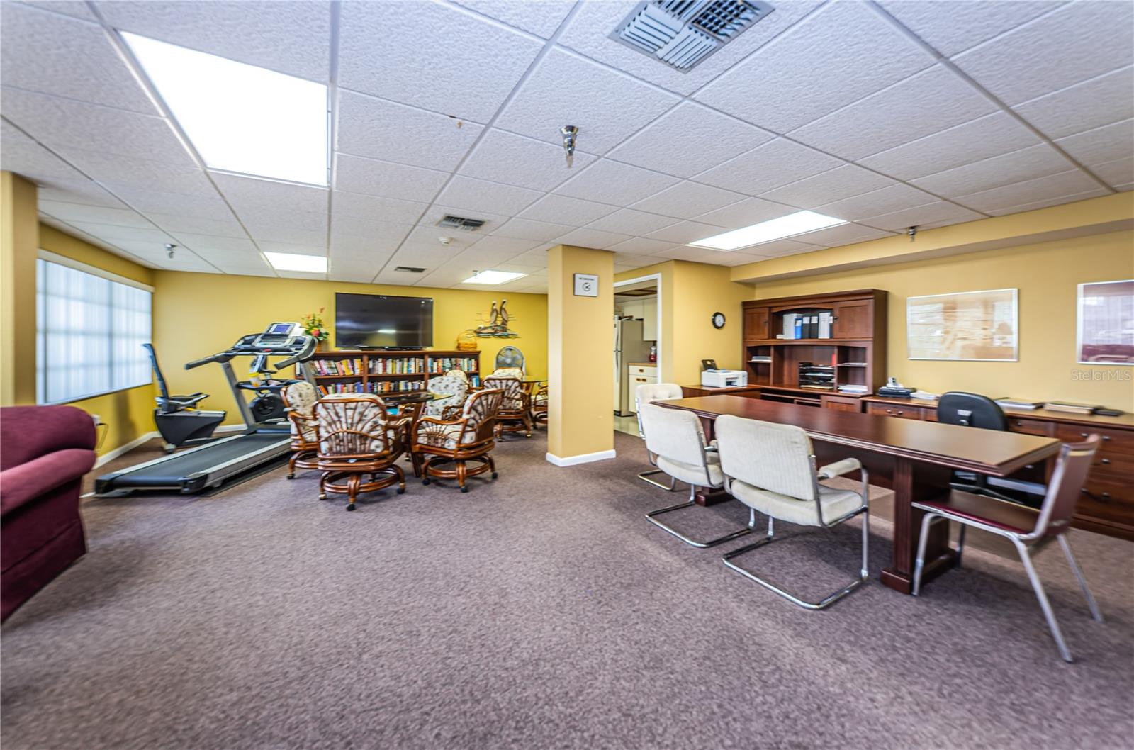 Clubhouse room with exercise machines, books, etc.  Meetings are held here along with parties etc.