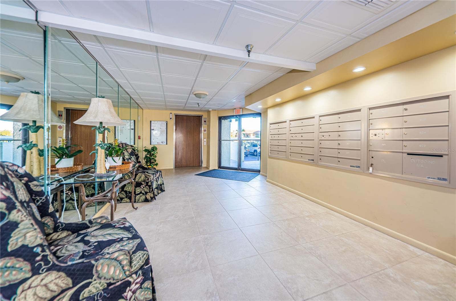 Lobby, mailboxes, entry to clubroom, and rear door to pool.