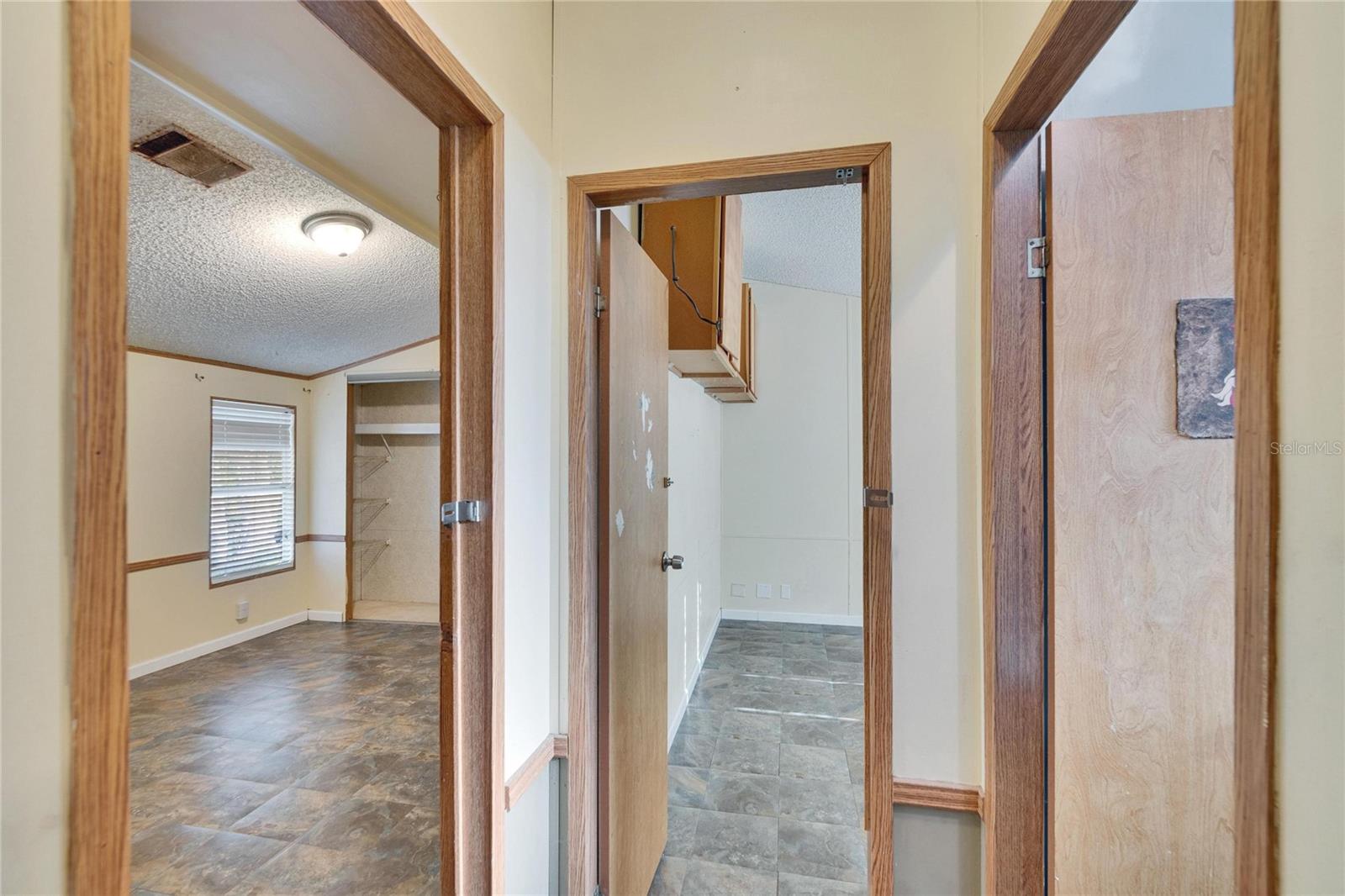 View from hallway to Bedrooms and Hall Bathroom to the right