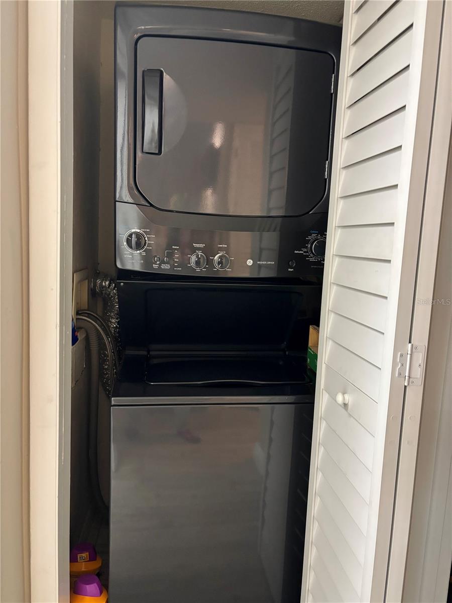 Utility Room with Stackable Washer and Dryer