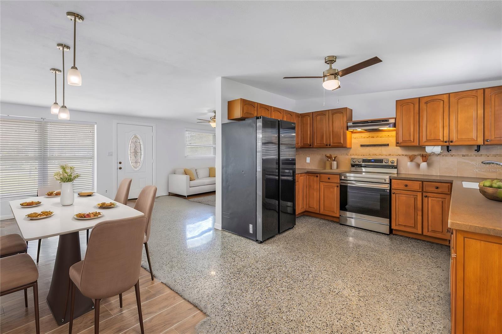 Virtually staged dining room off the kitchen. Ideal for hosting and staying connected while the chef is in the kitchen.