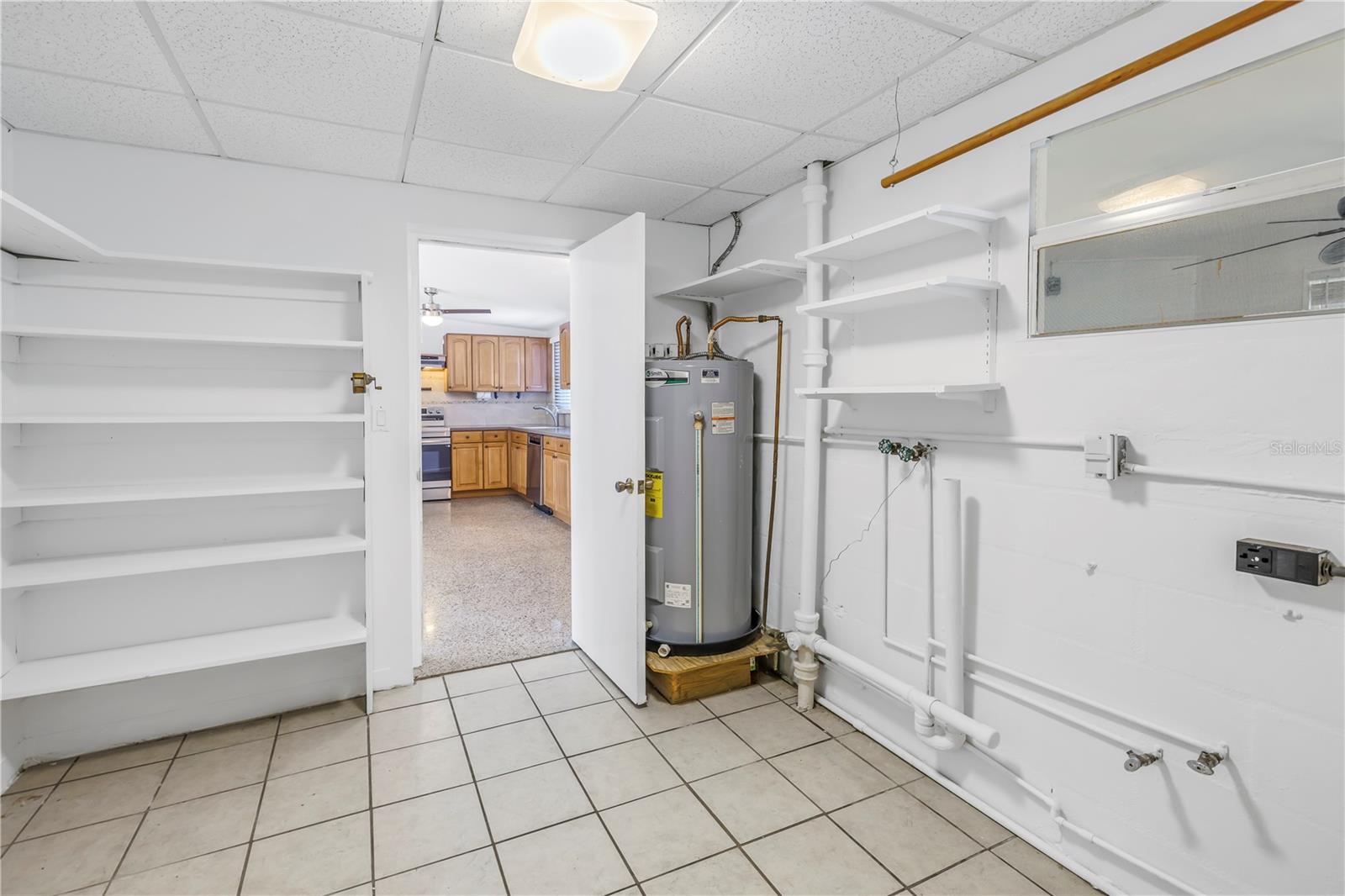 Laundry room with additional storage space.