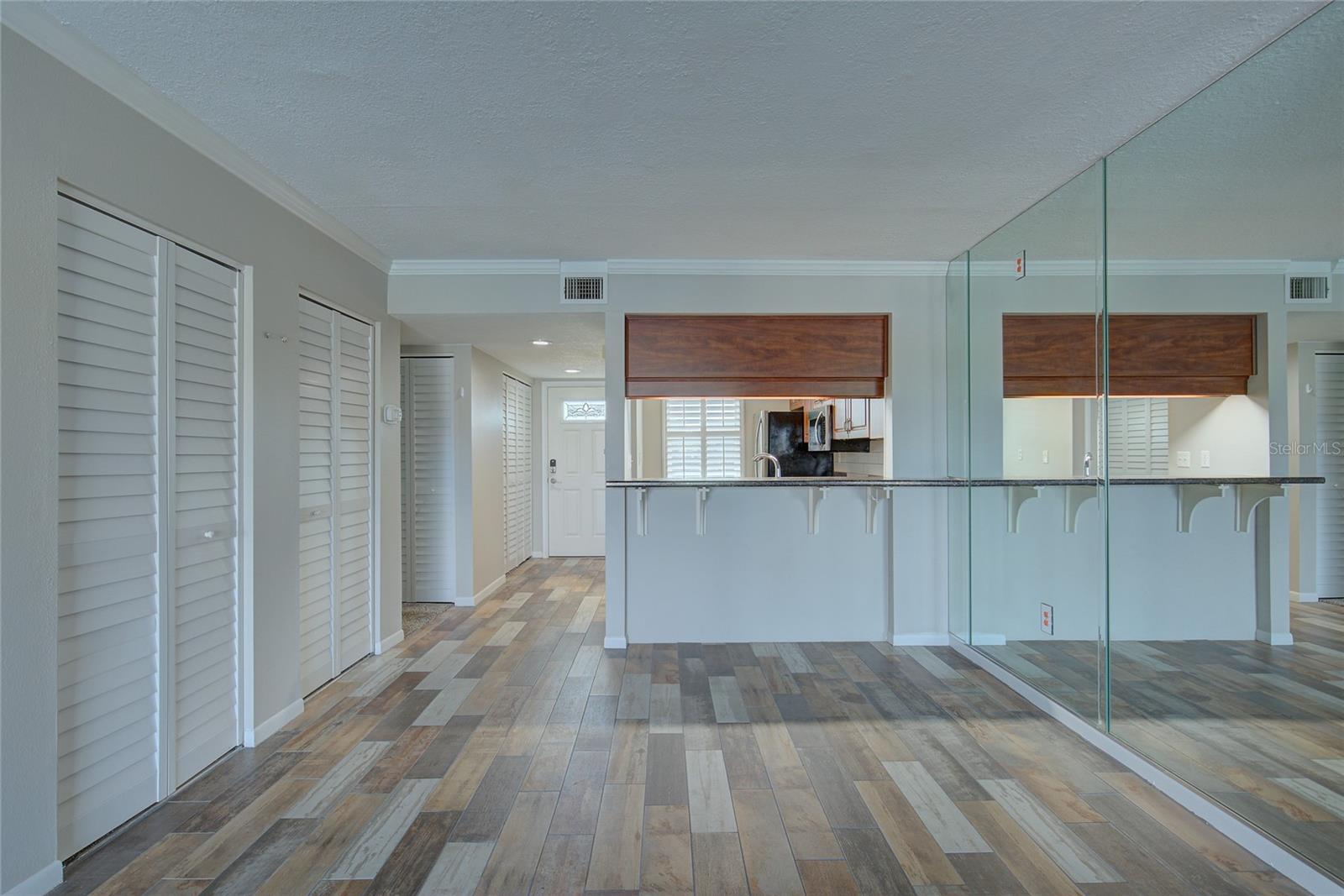 Main entrance door, kitchen, and dining room