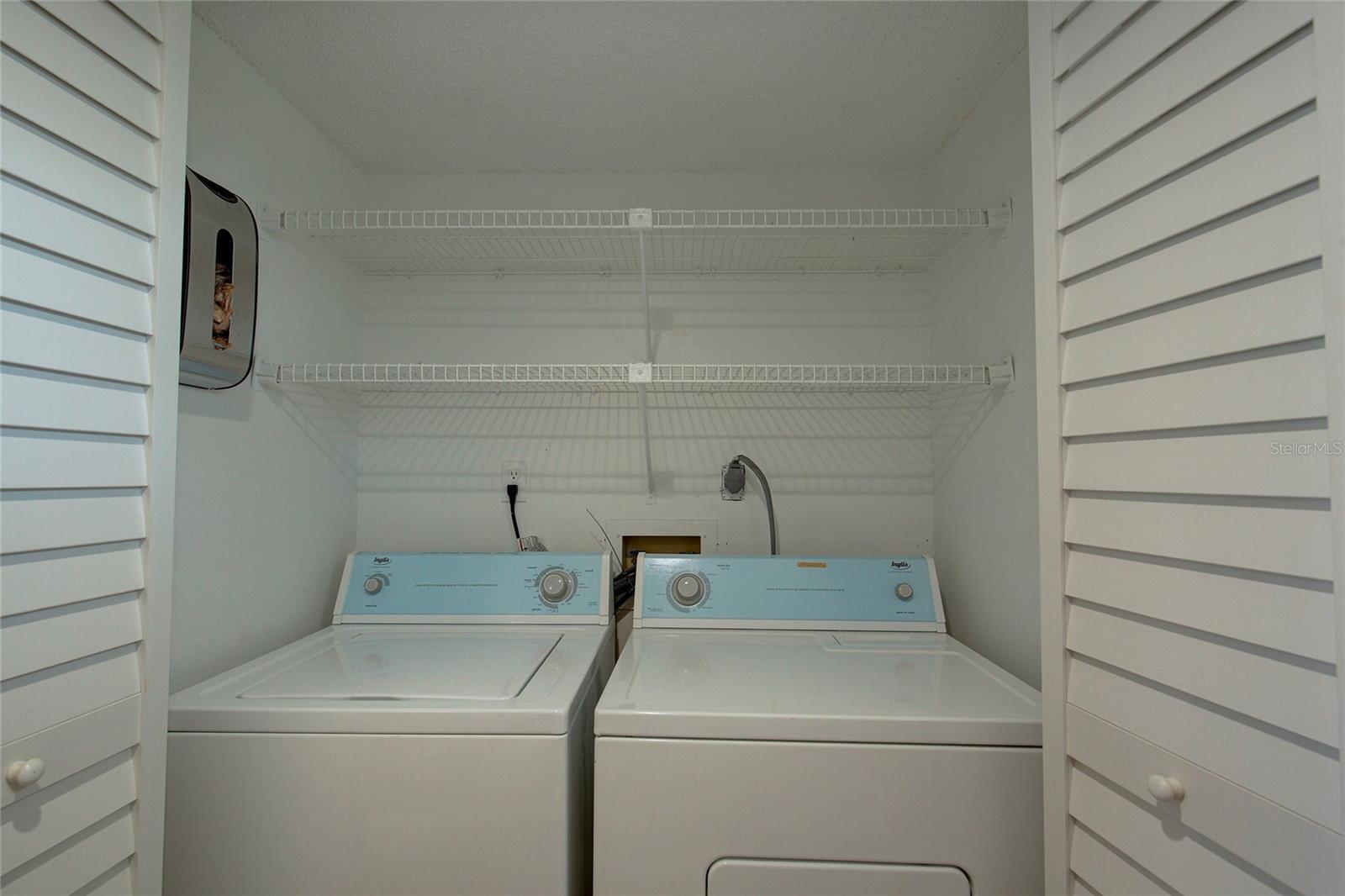 Laundry closet by entrance door