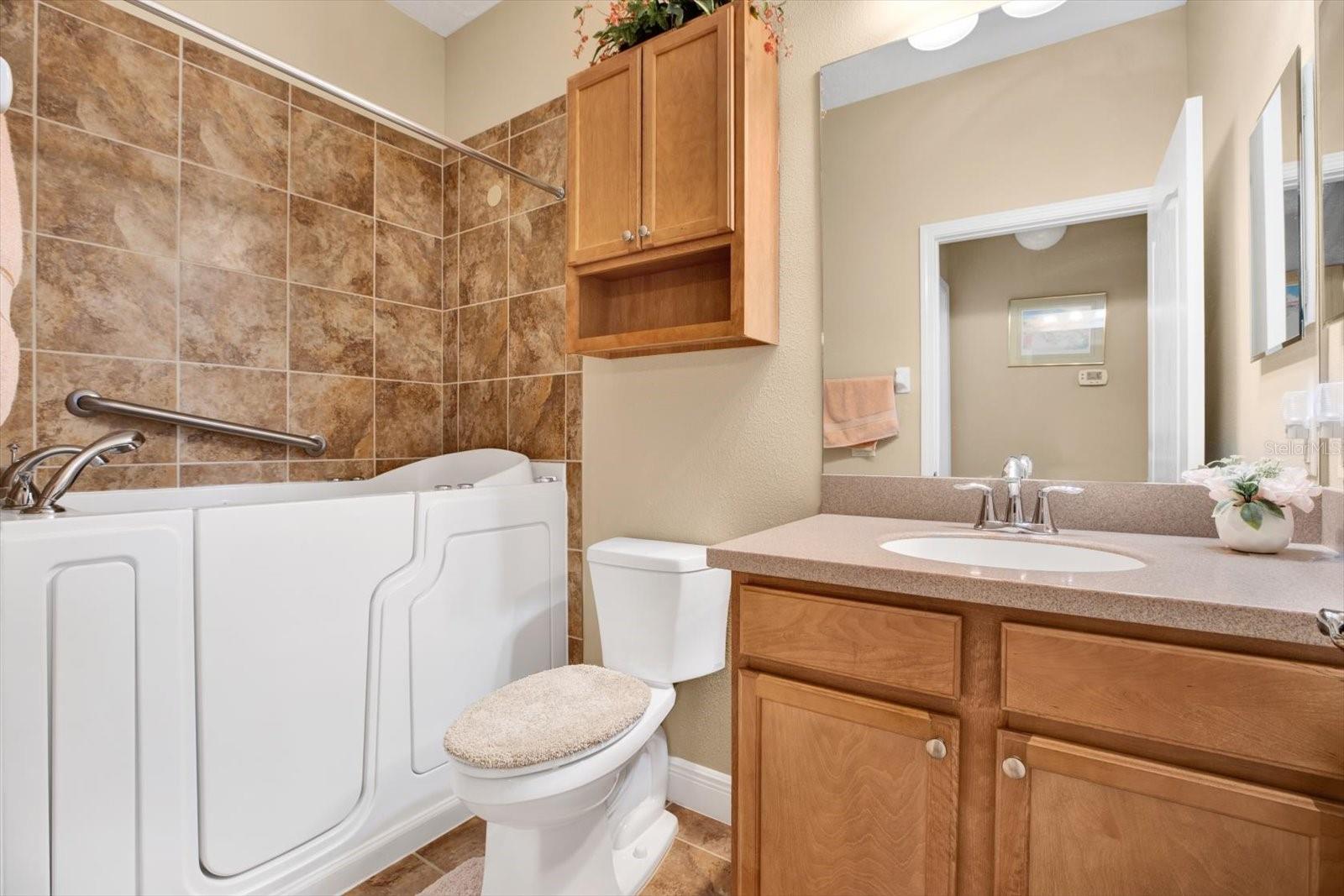 Hall bath has Safe Step walk-in jetted tub.