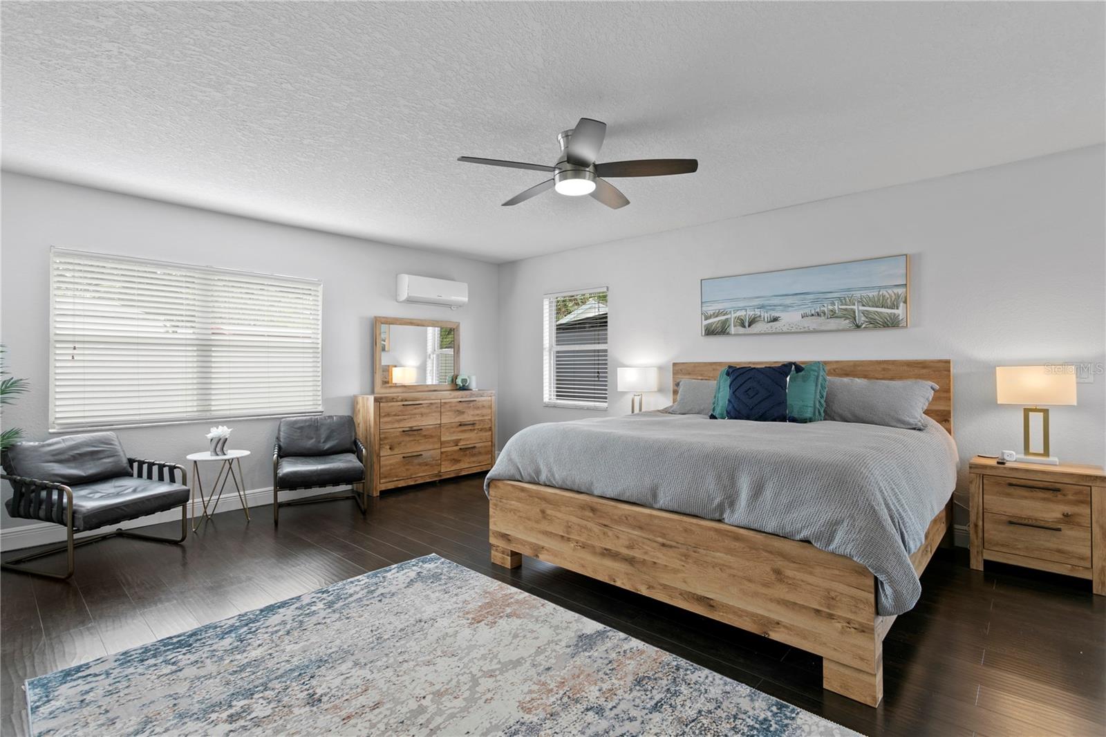 Primary bedroom with french doors to backyard