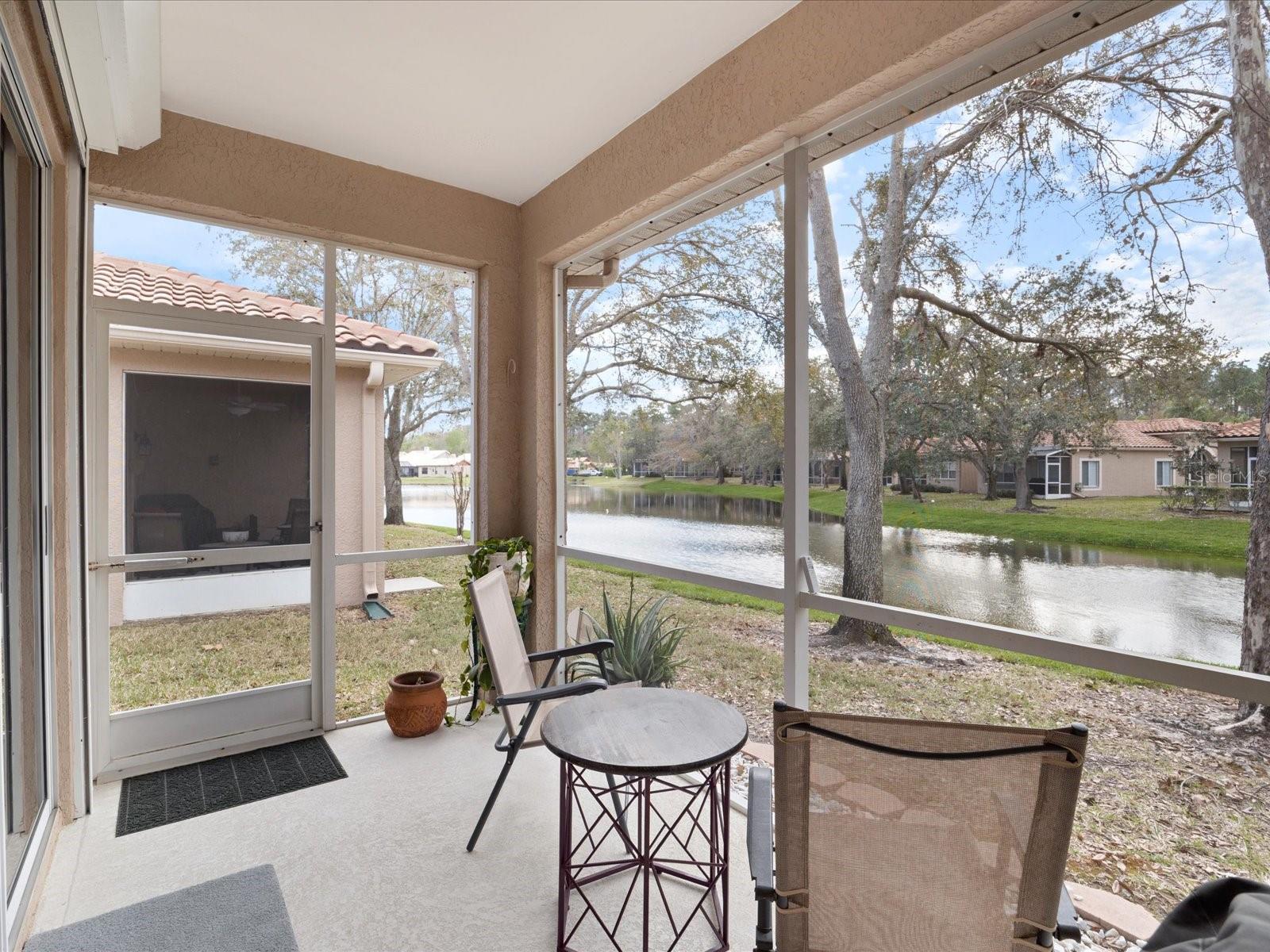 Rear lanai with quiet view of pond with ducks, deer and wildlife