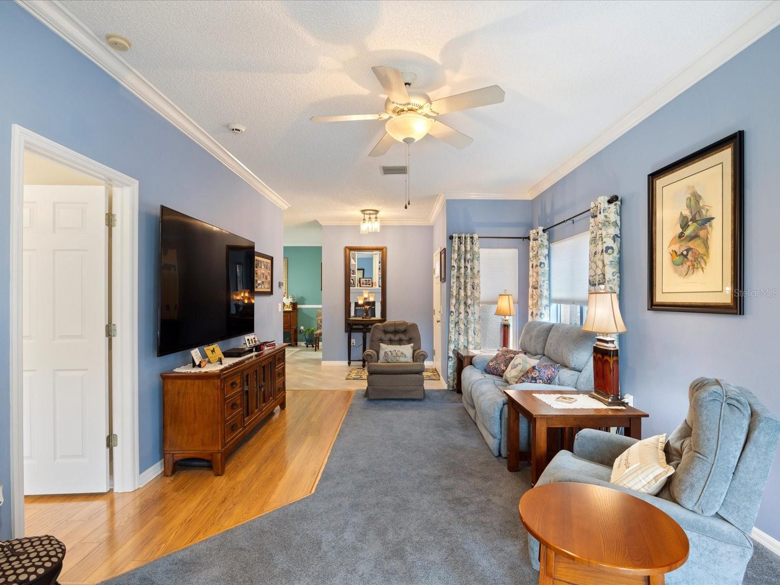 Living room with door on the left to primary bedroom