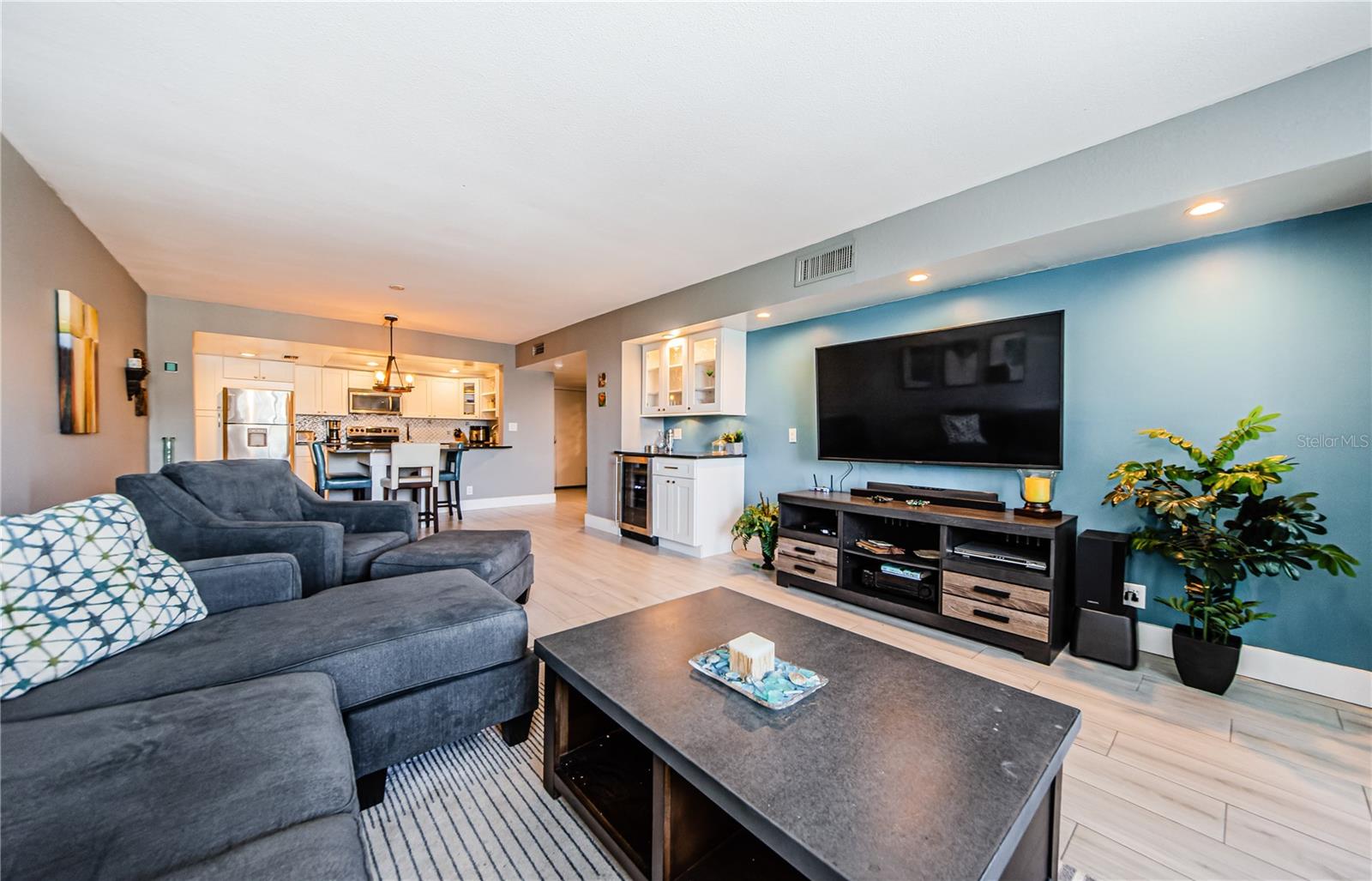 Large living room with dry bar and beverage cooler.