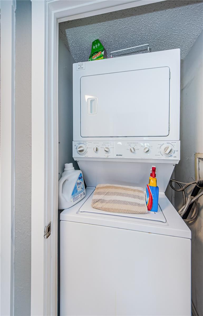 Stacking washer dryer closet in the hall. So convenient.