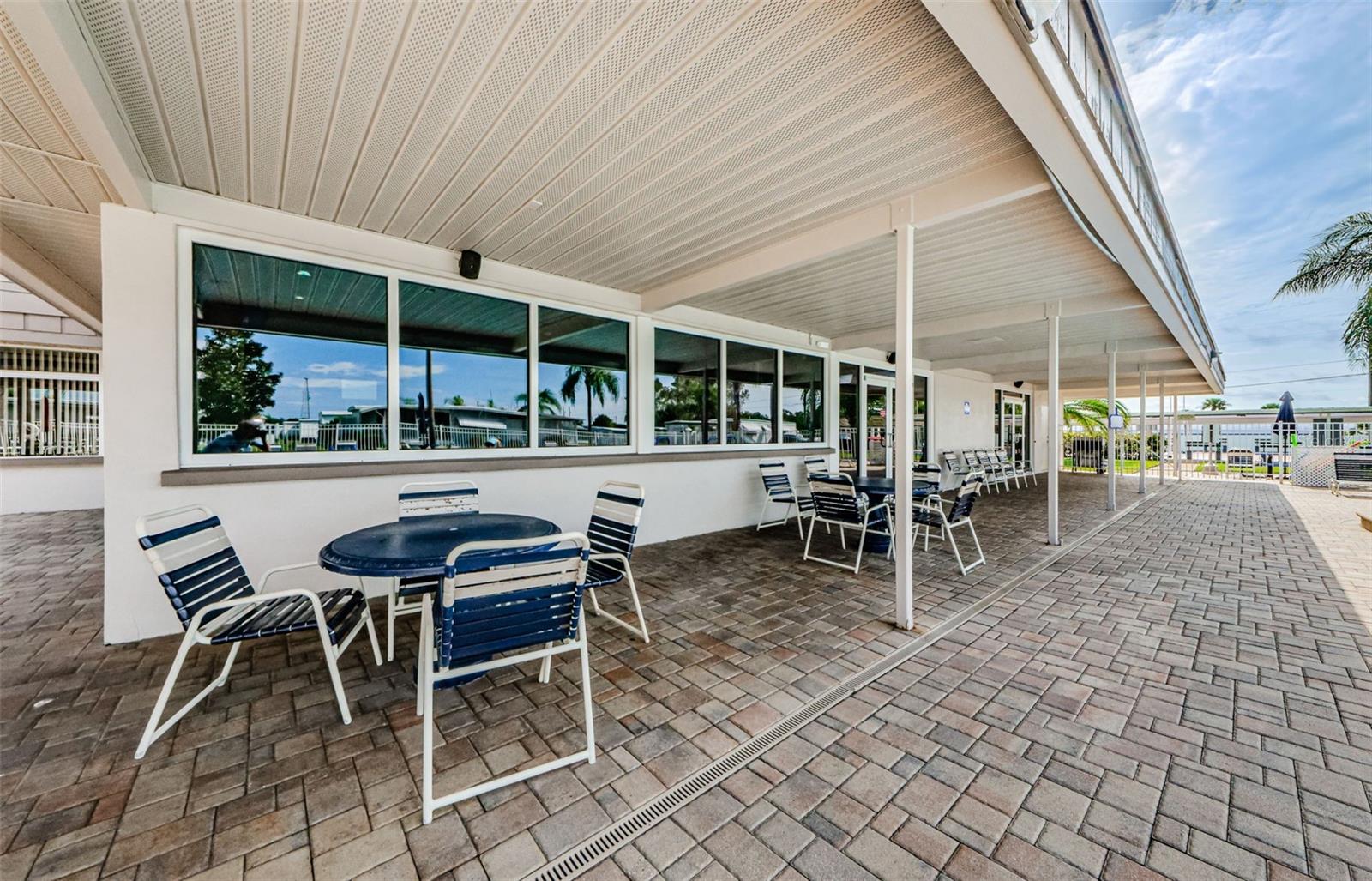 Plenty of seating available on the patio of the community pool