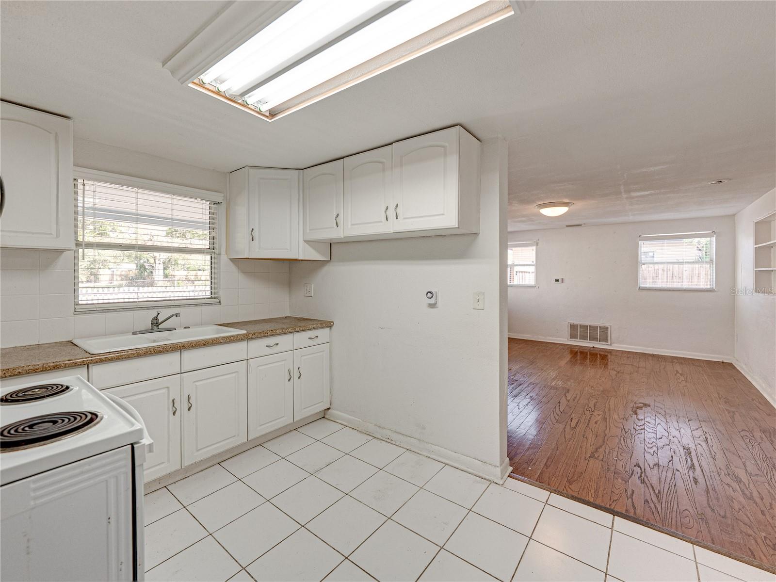 Kitchen opens to living room