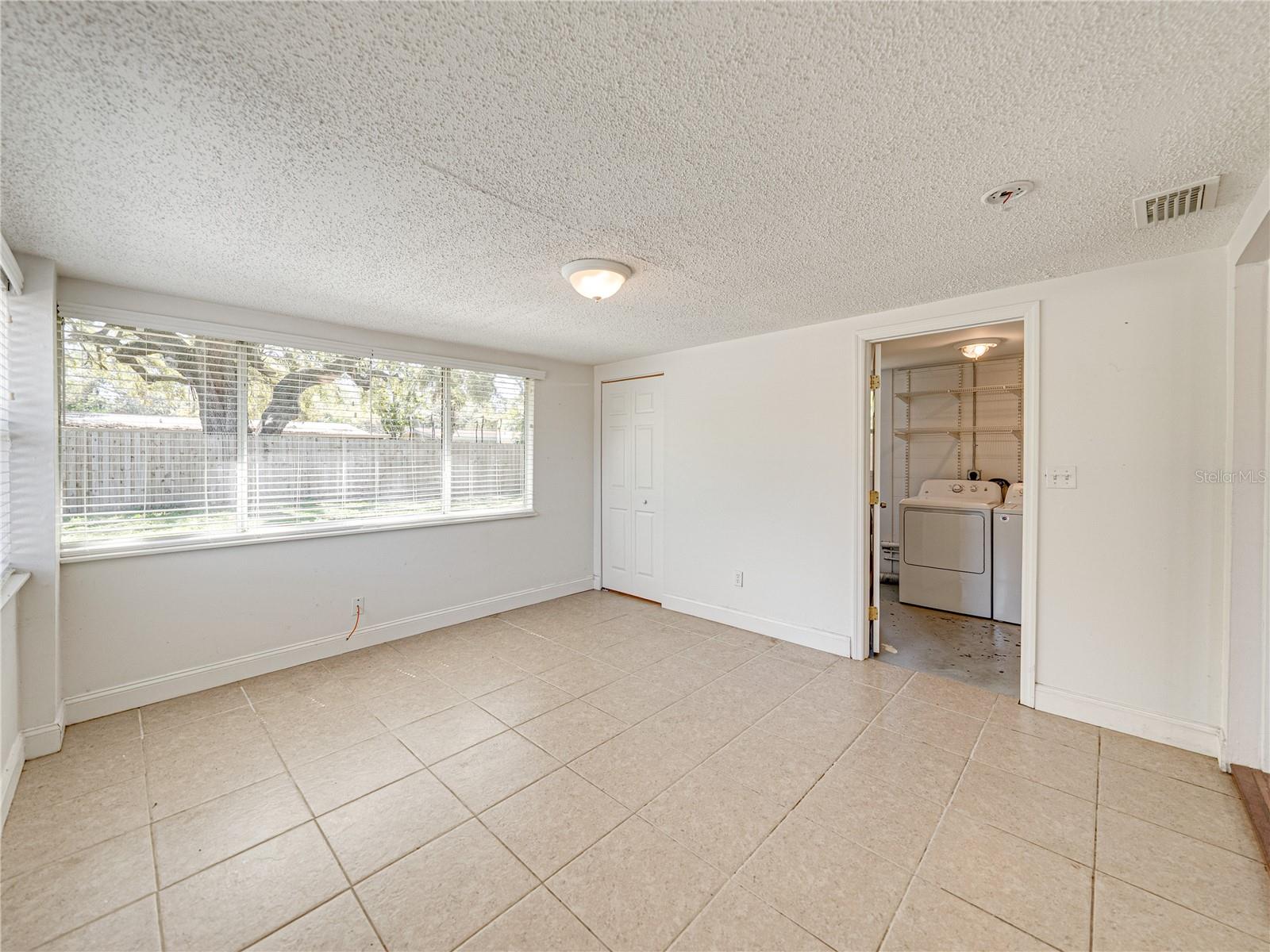 Laundry room located off the primary bedroom.