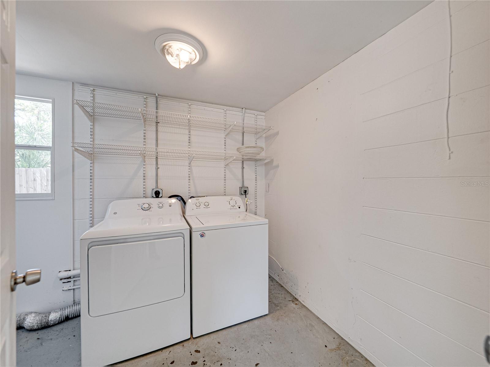 8 x 7 Ft laundry room also has extra room for storage to left of washer and dryer.