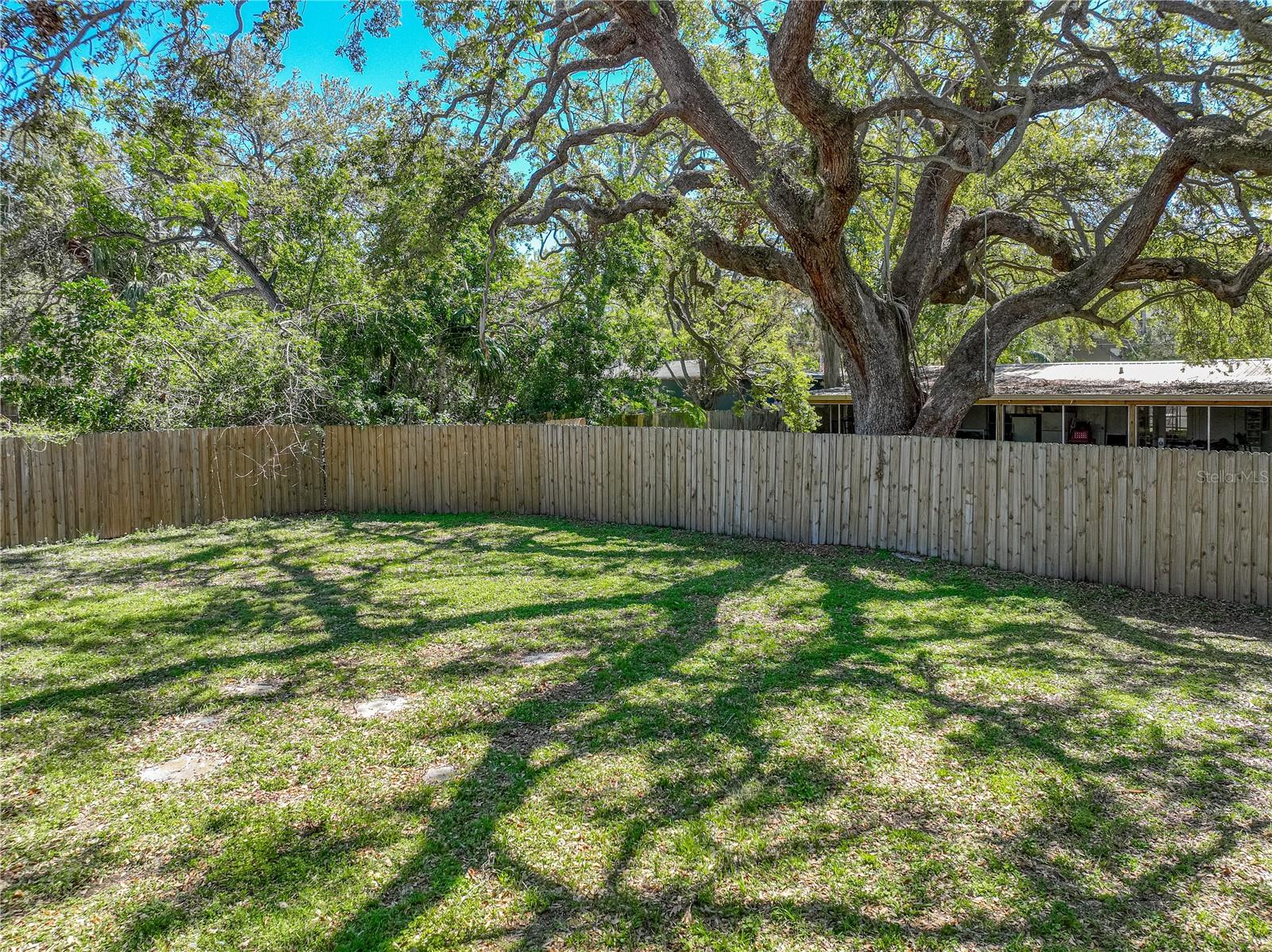 Large, fenced lot with plenty of room for entertaining family and friends.