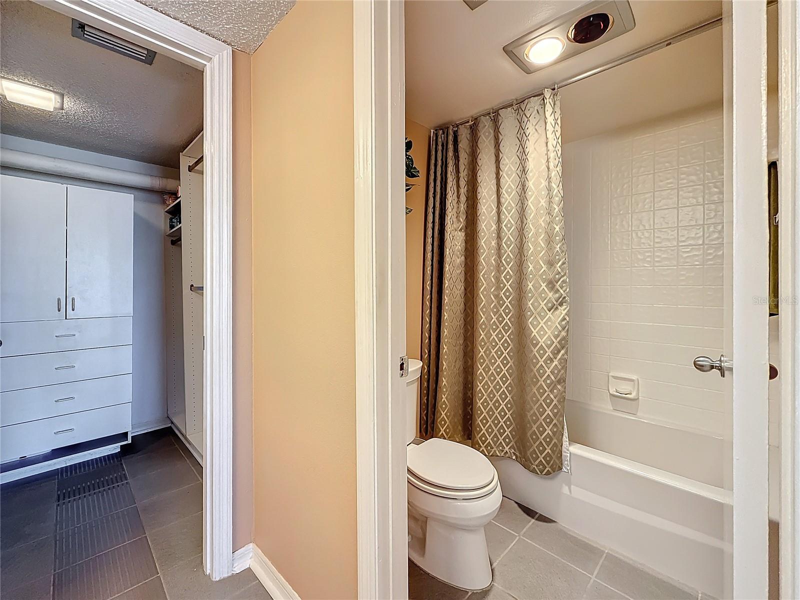 Another look at the primary bath and walk-in closet.  This condo has 2 bathrooms and both have tubs with a shower.