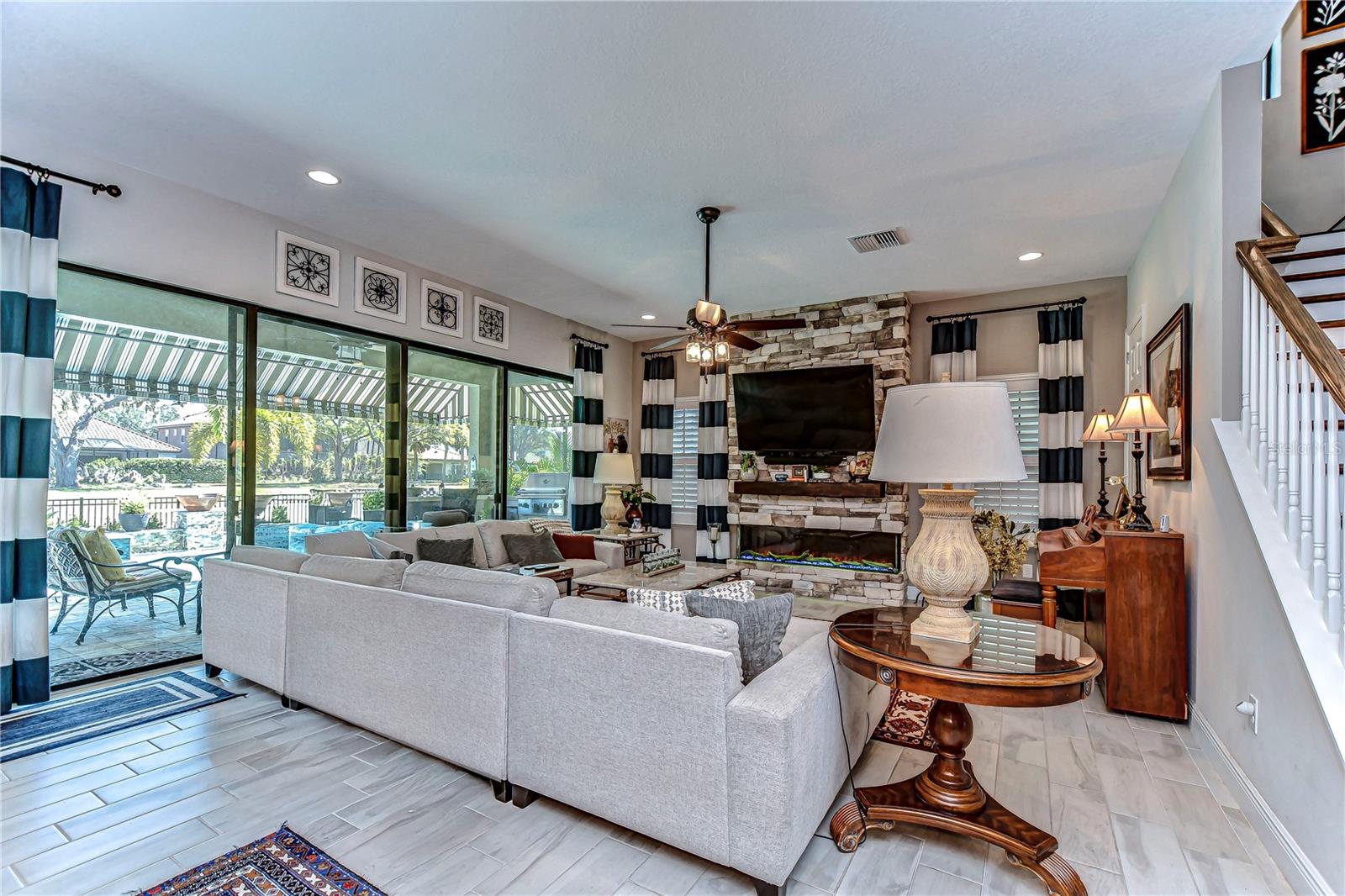 This inviting living room effortlessly blends comfort with sophistication, offering a picturesque view of the outdoors.