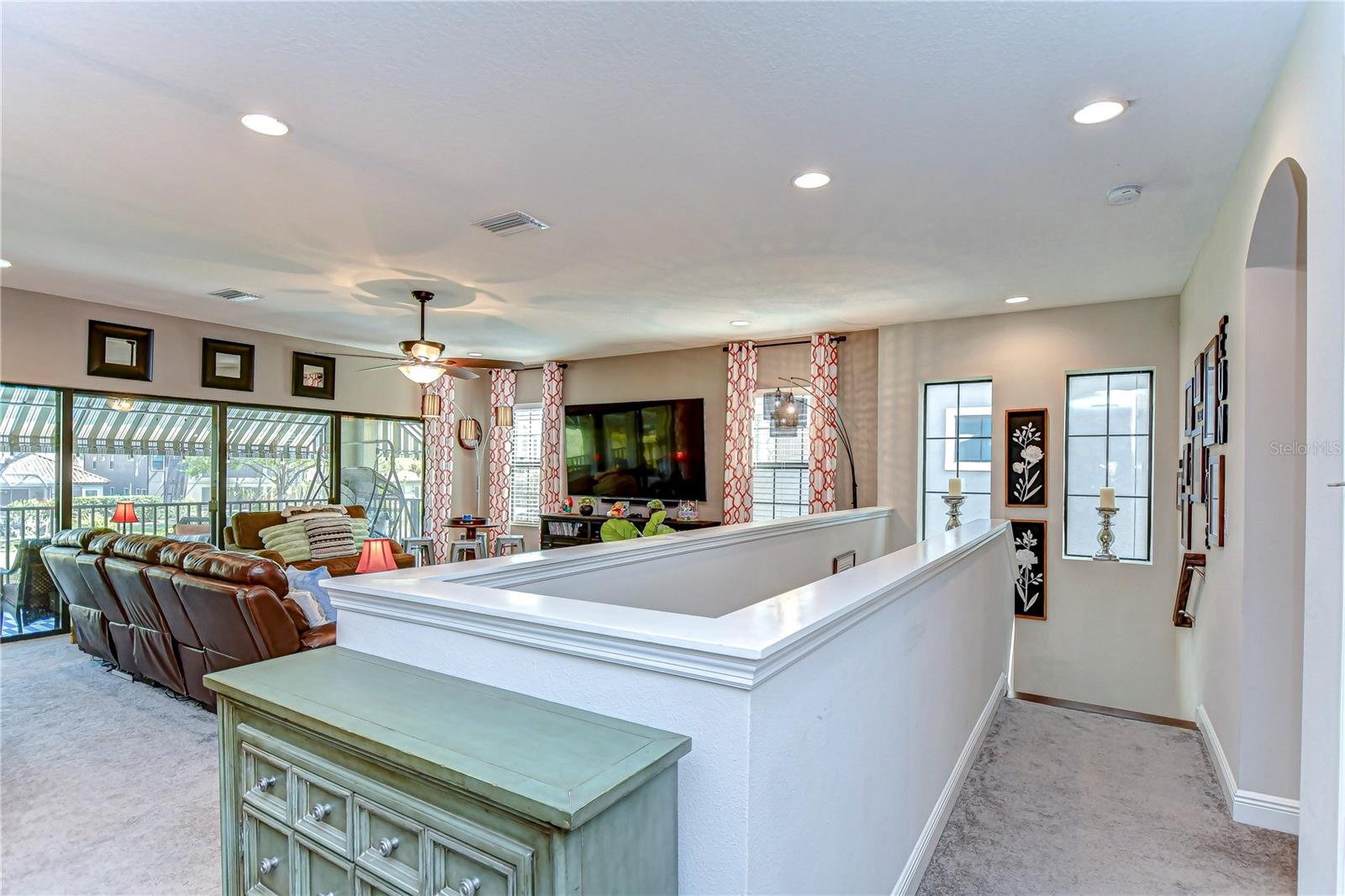 Natural light pours through large windows, making this loft perfect for entertaining or lounging!