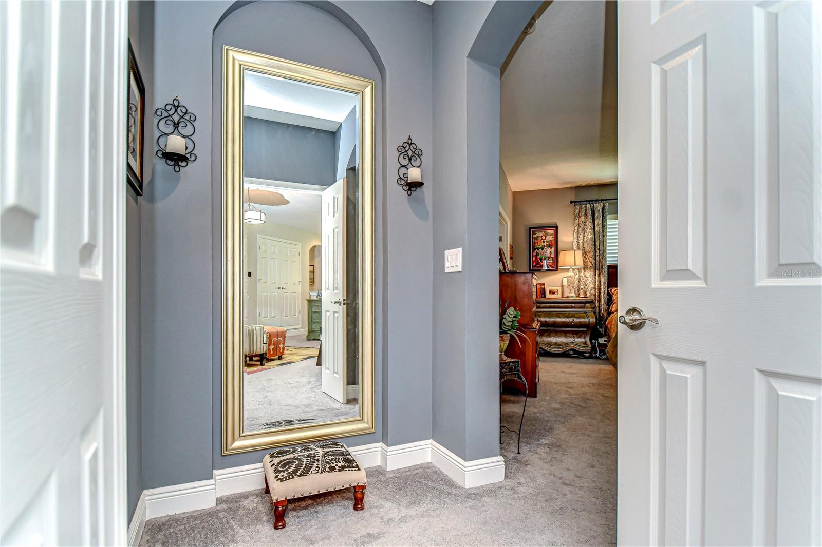 Through the grand double doors into your primary oasis.