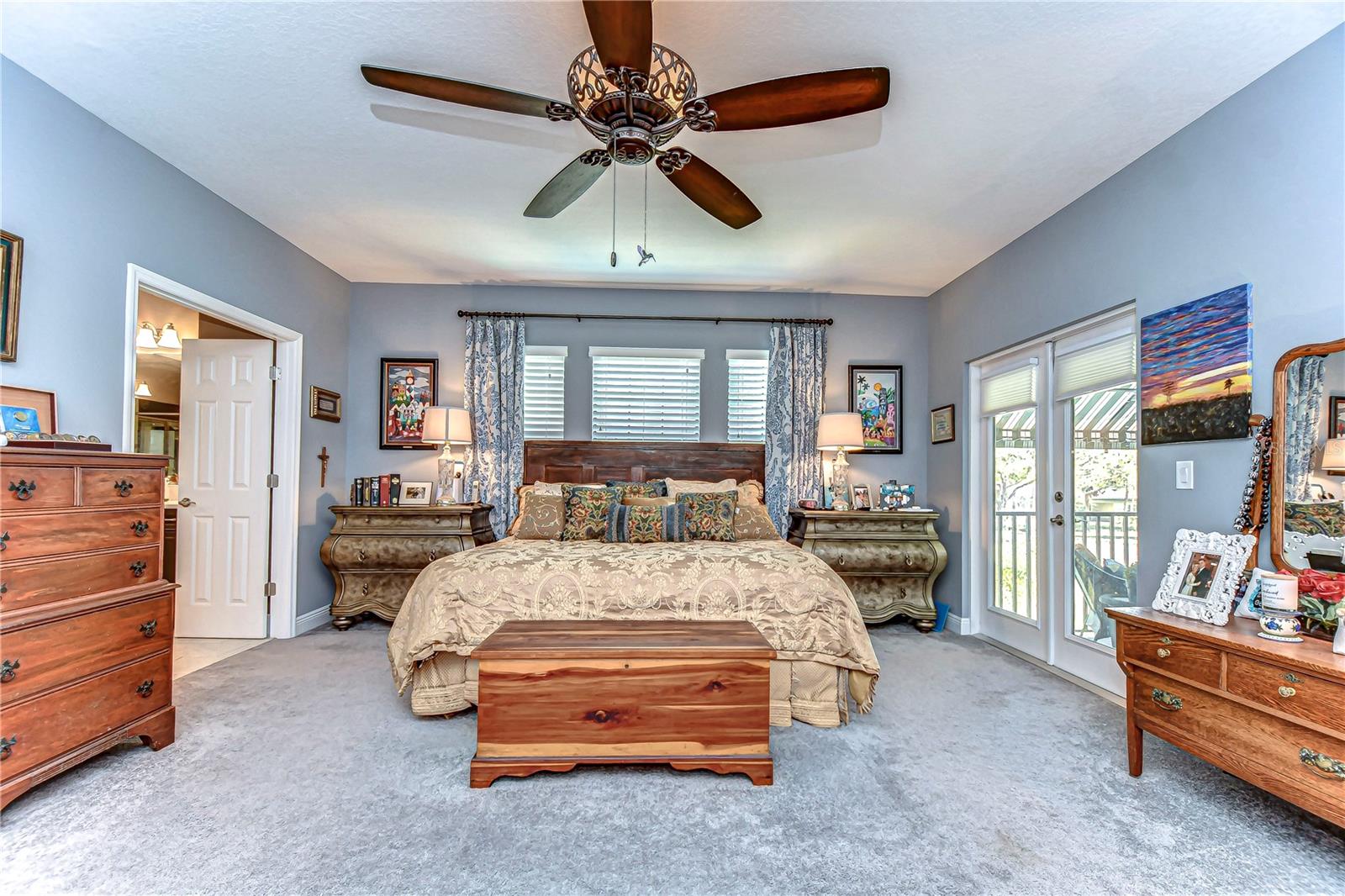 Retreat to this spacious primary bedroom, featuring elegant design and ample natural light