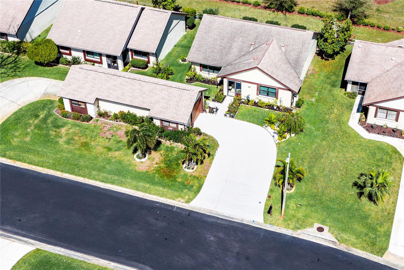 SINGLE-FAMILY HOME WITH GARAGE AND PRIVATE DRIVEWAY. GARAGES CONNECT WITH NEIGHBOR'S GARAGE.