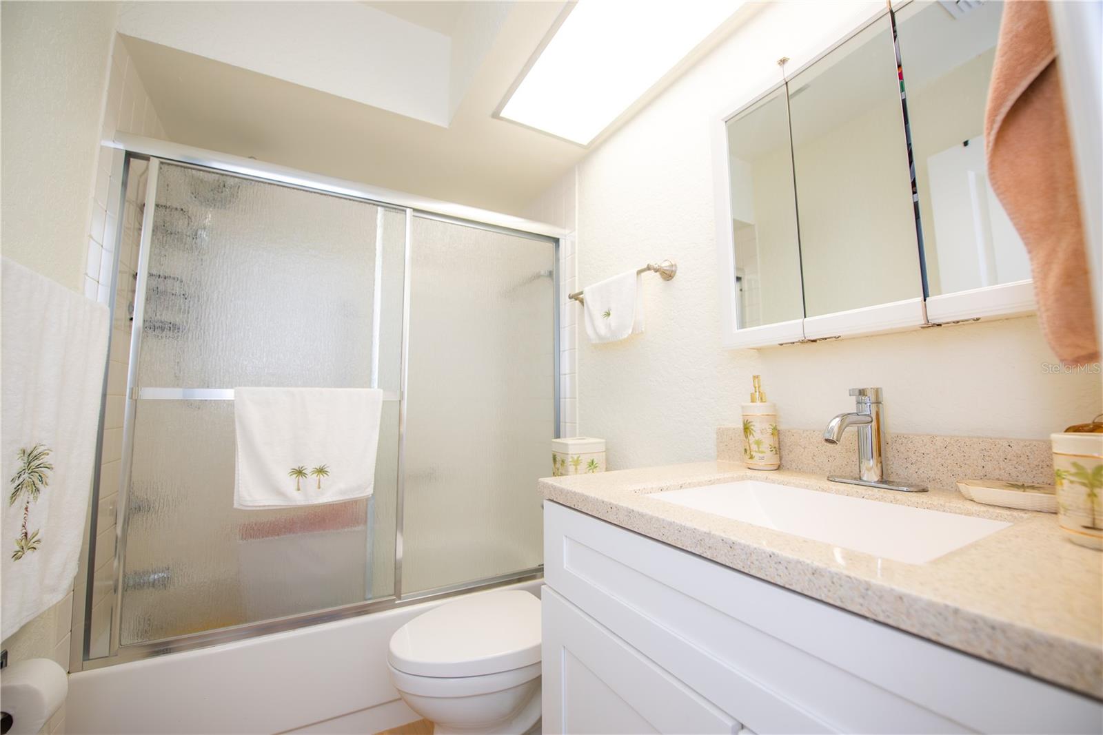 2ND BATHROOM WITH UPDATED CABINET.