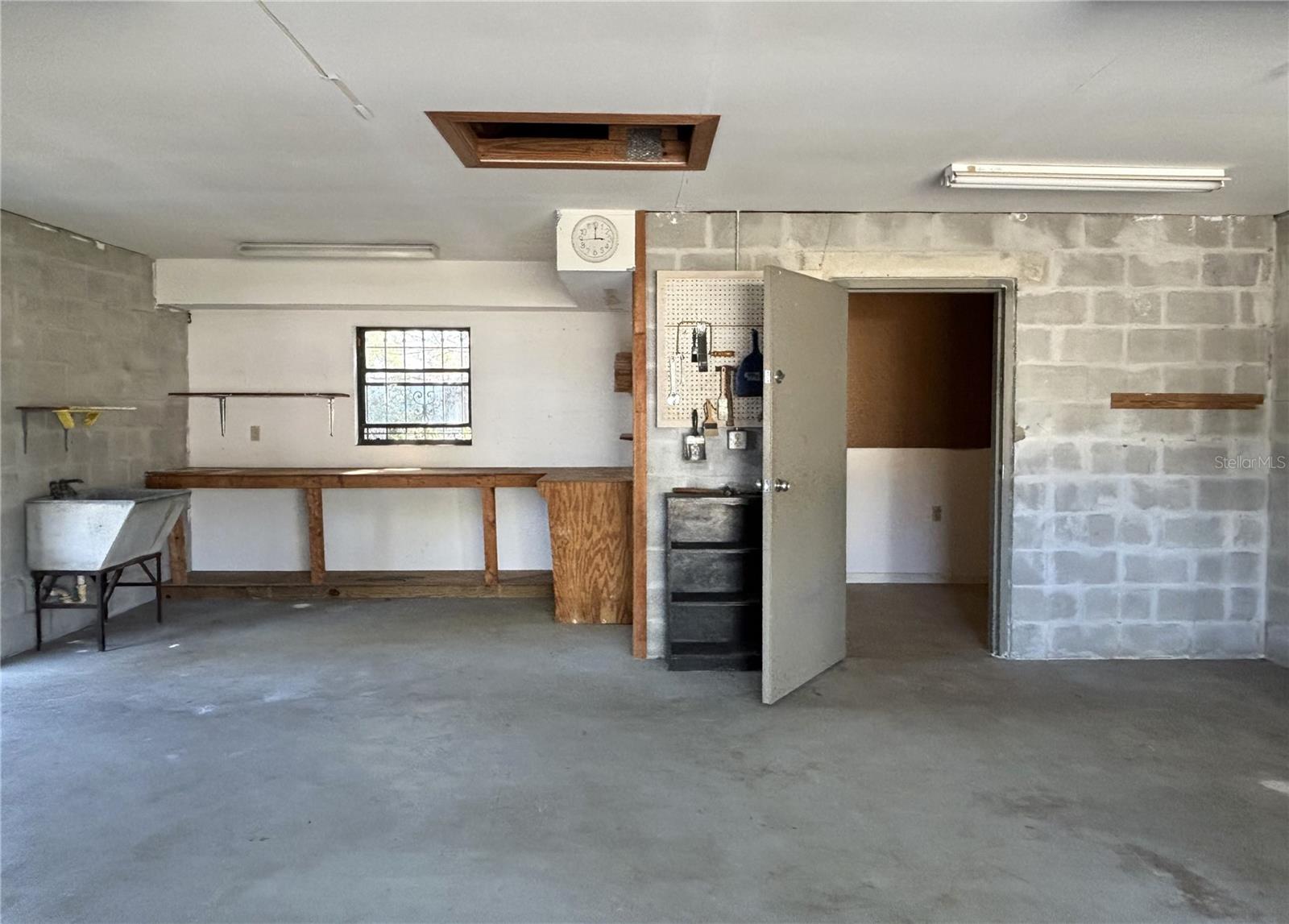 Work Area and Storage Room in Garage