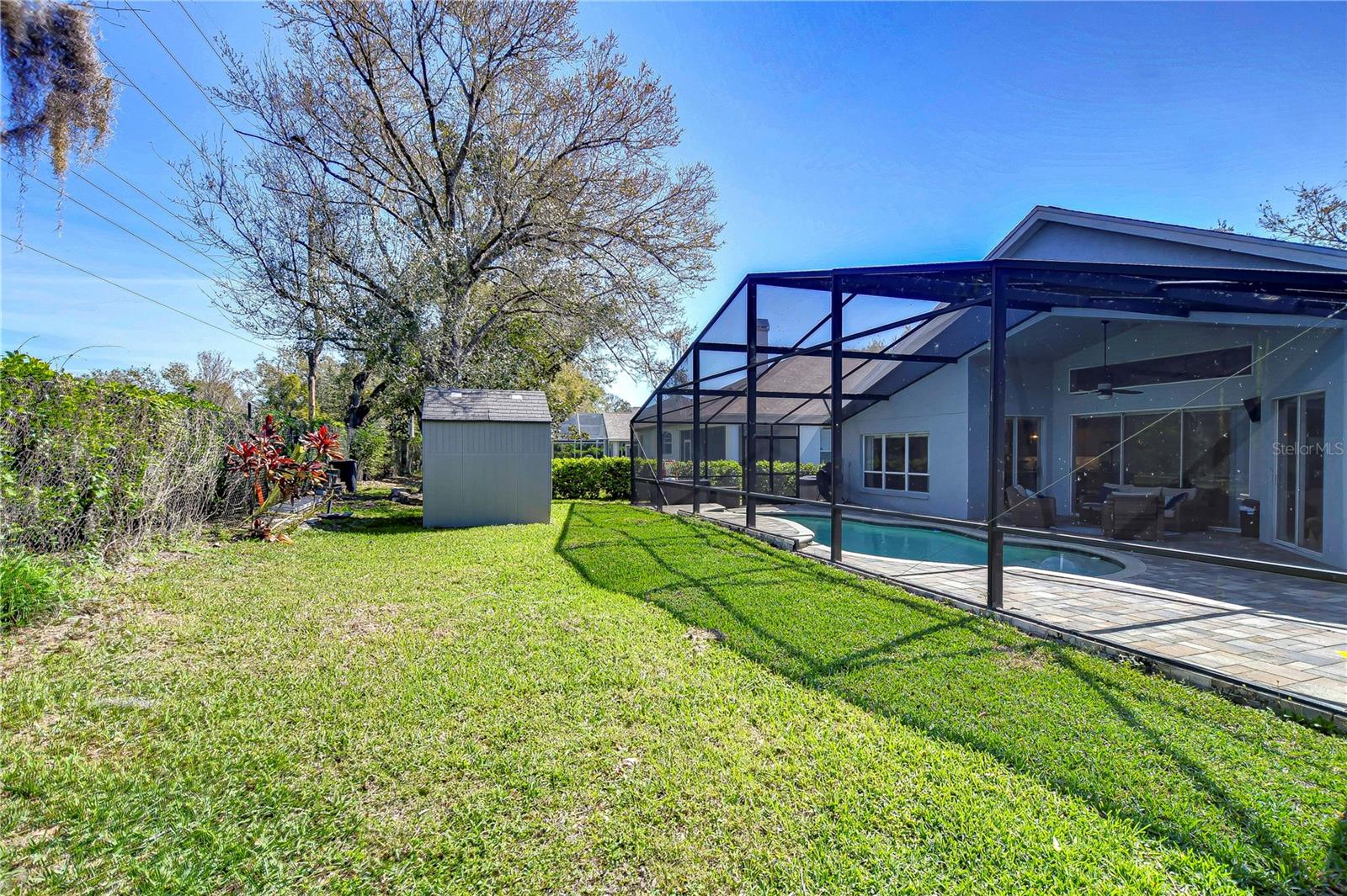 Embrace the sunny Florida lifestyle with this spacious backyard oasis