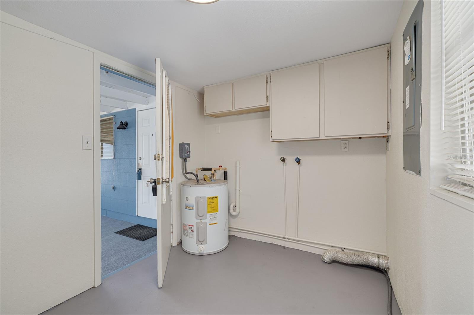 Laundry room off front screened-in porch