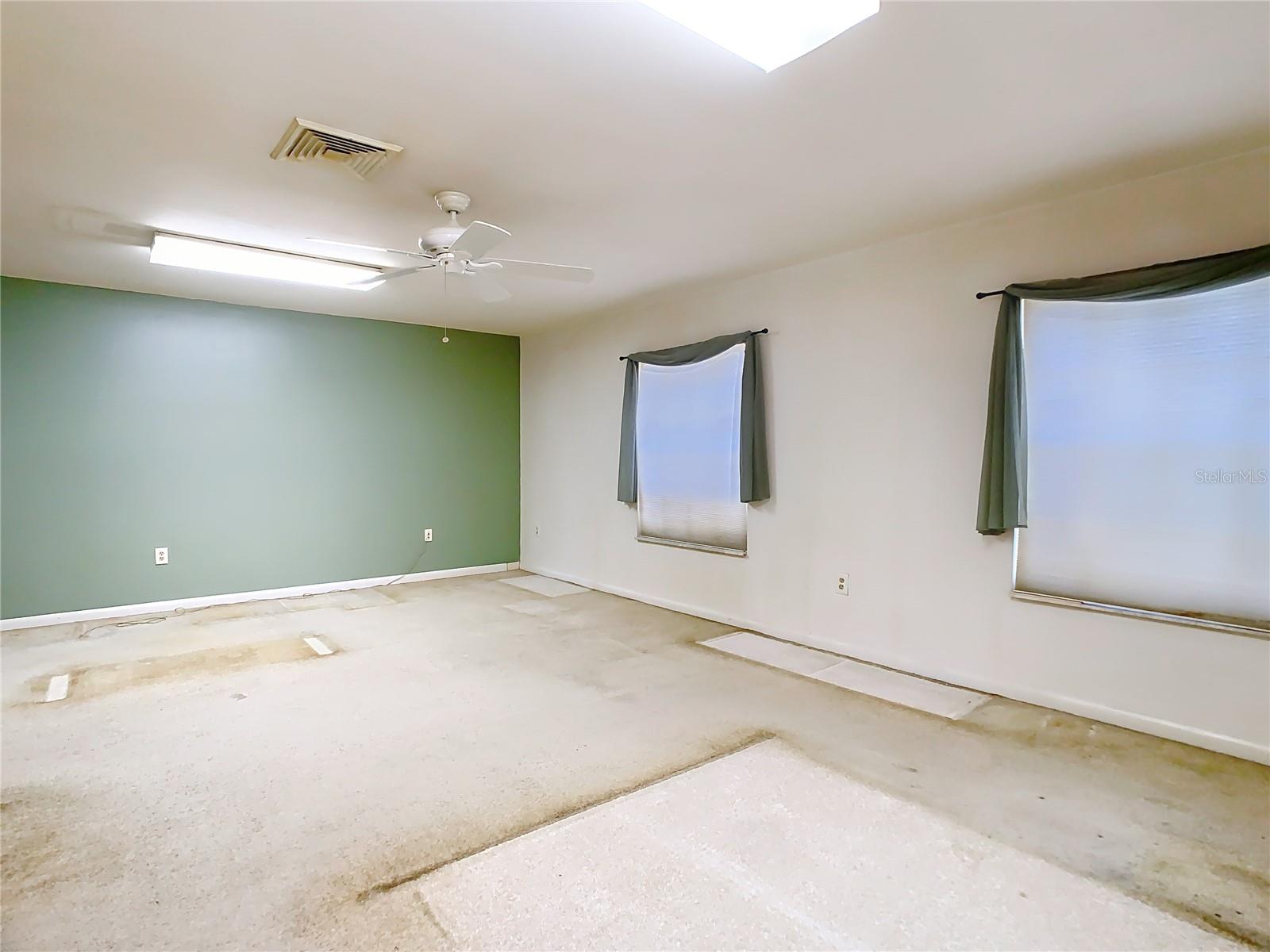 Spacious primary bedroom upstairs