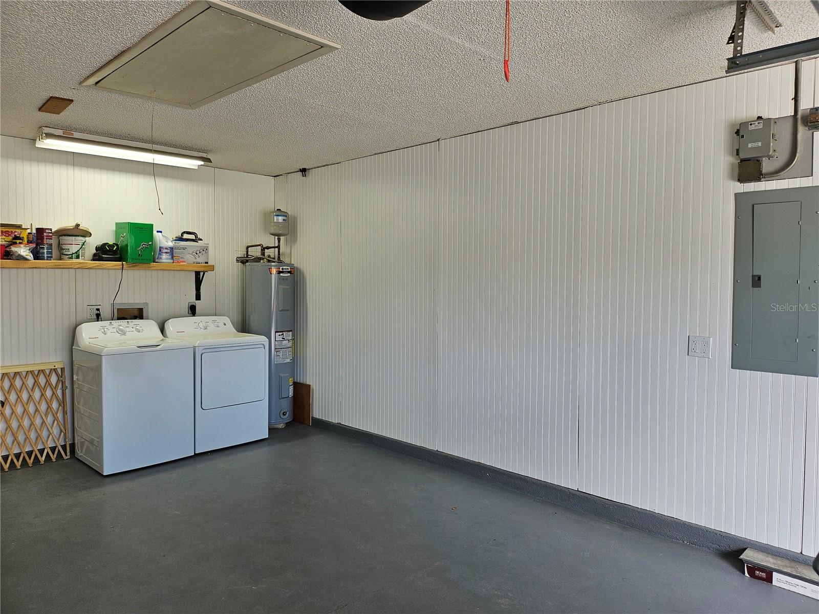 Garage with new Hotpoint Washer and Dryer