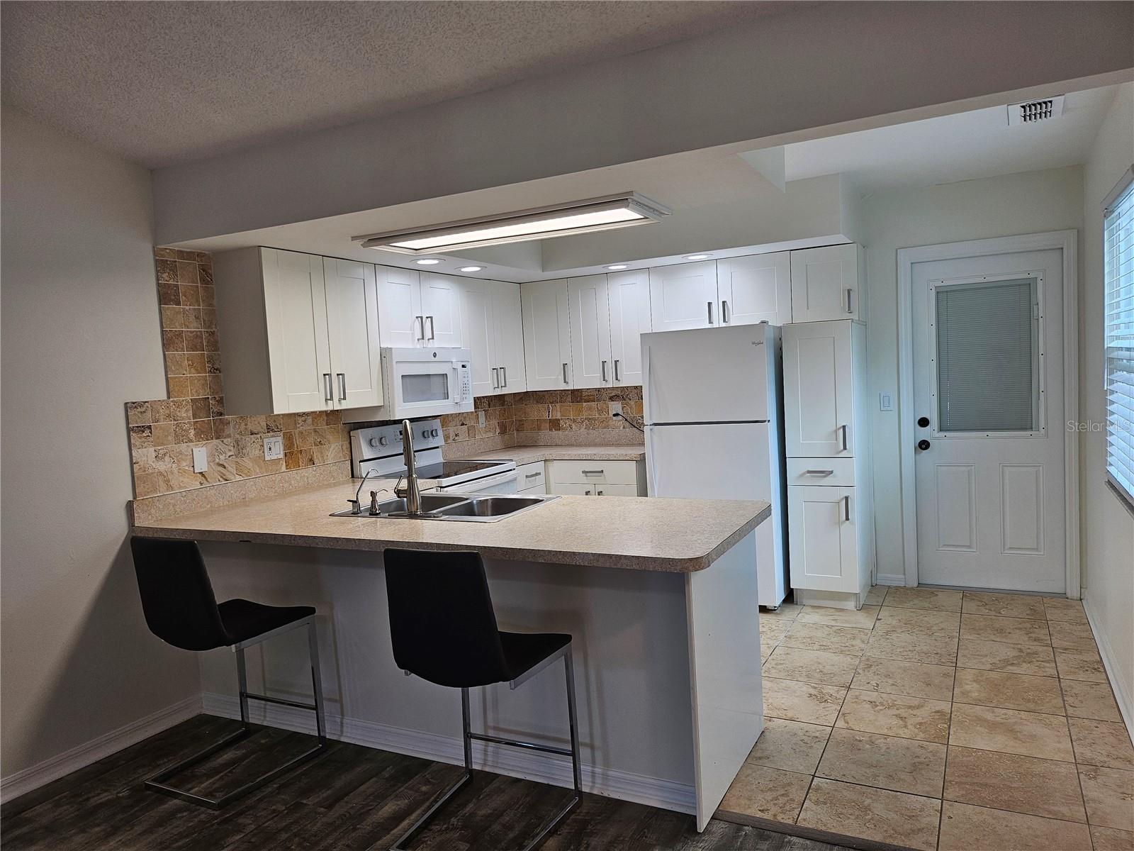 Kitchen leading out to garage