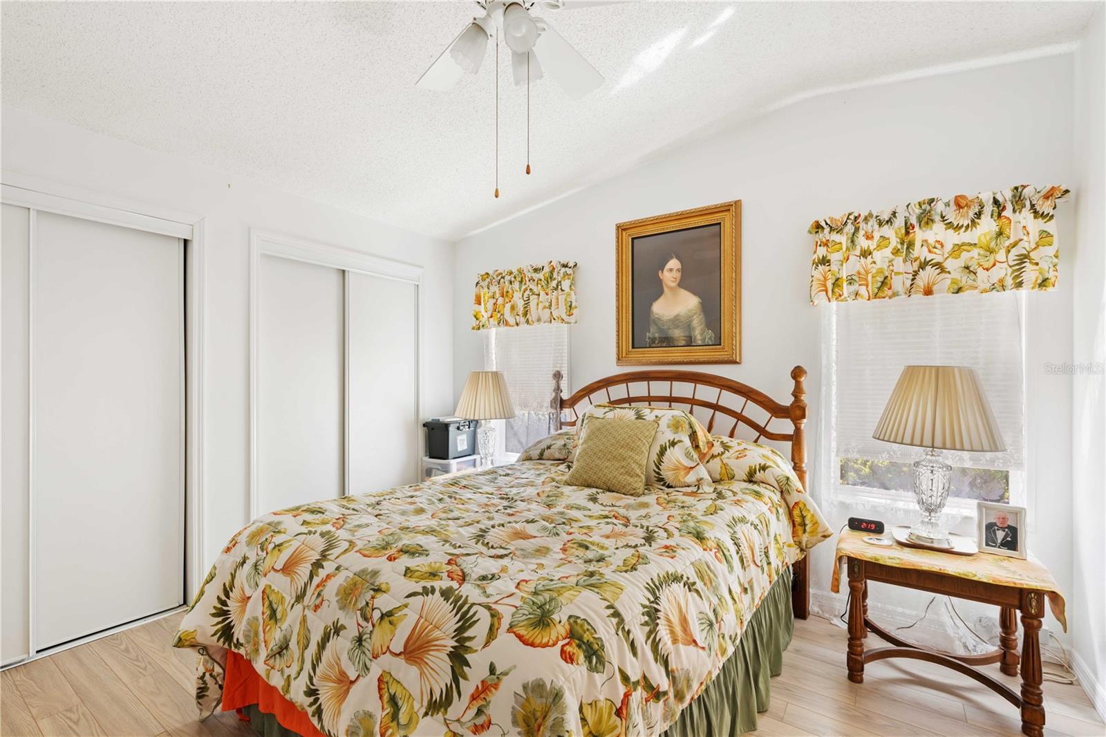 Bright primary bedroom with double closets