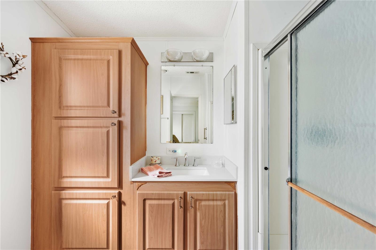 Primary bedroom ensuite with lots of cabinets