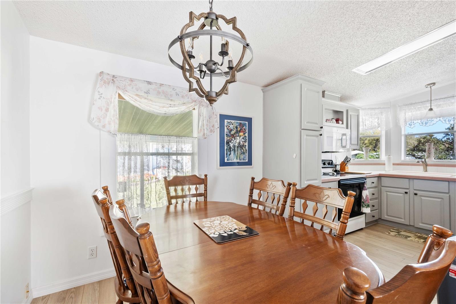 Dining opens to kitchen and living areas