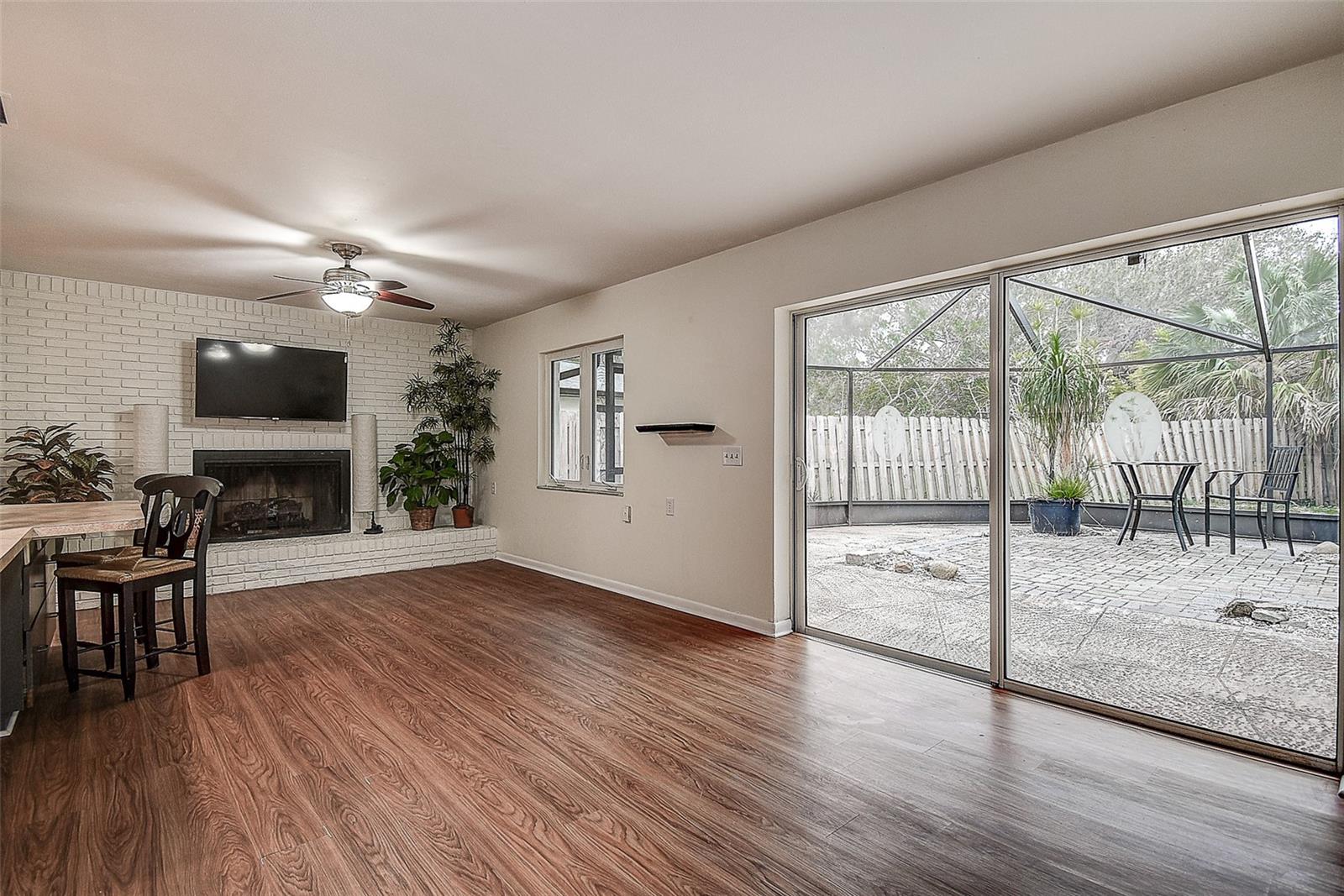 Walk out to large screened patio and back yard.