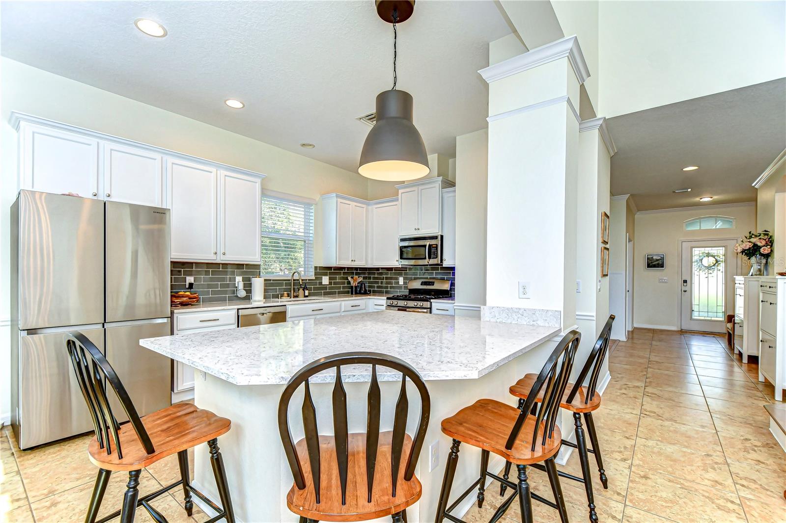 Enjoy stainless steel appliances, elegant cabinets, and a sunlit ambiance