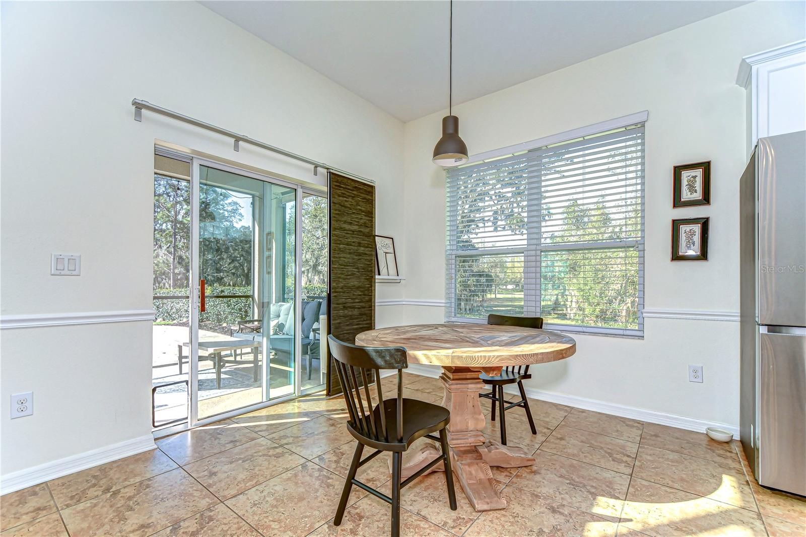 This charming breakfast nook perfectly blends indoor comfort with outdoor allure.