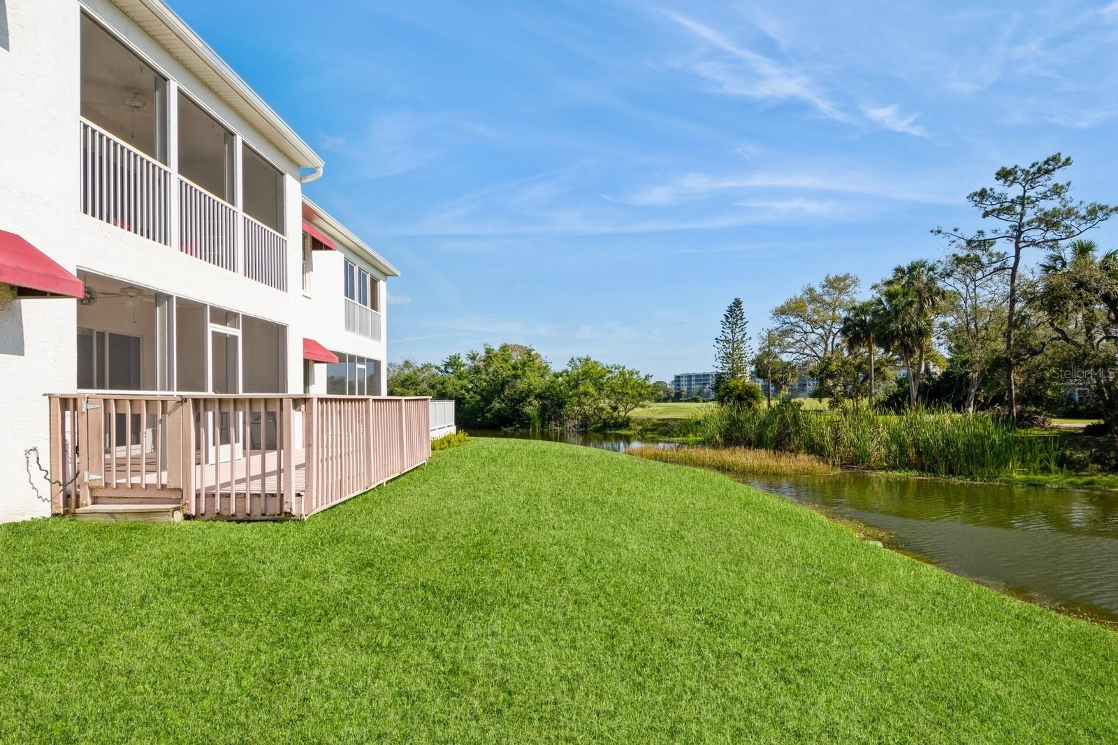 Relax and enjoy your lovely pond view from your new condo at East Bay Golf Villas