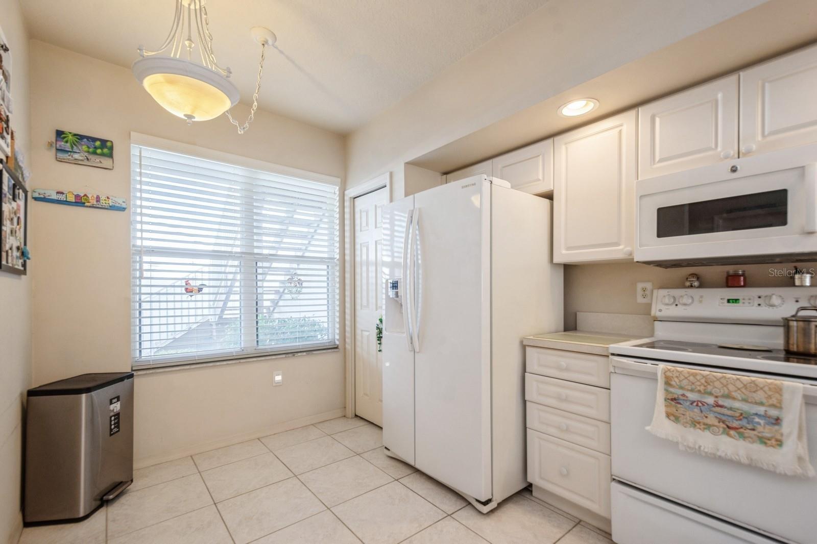 Bright kitchen with room for a cafe table and chairs