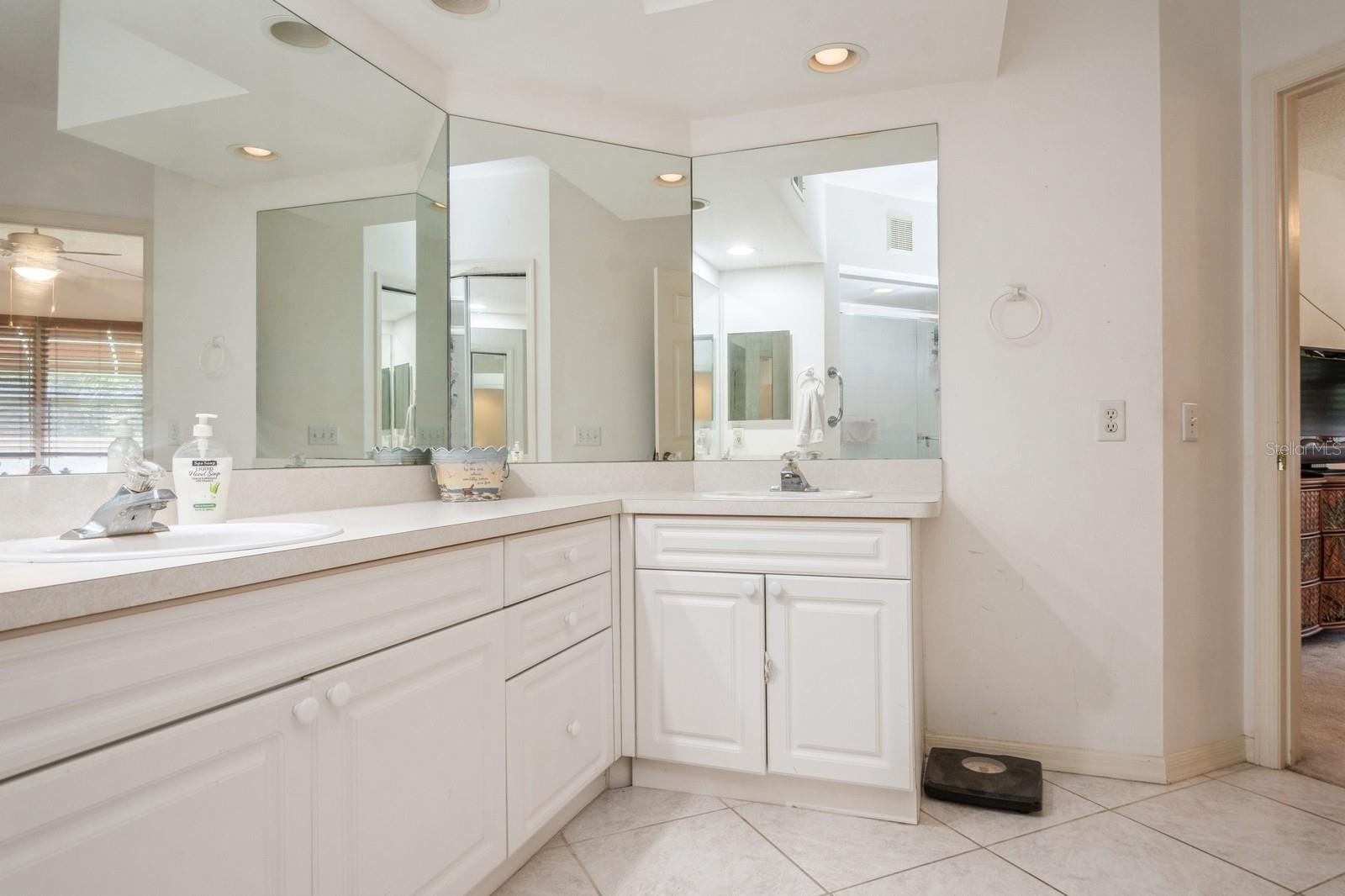 Large primary bathroom with dual sinks