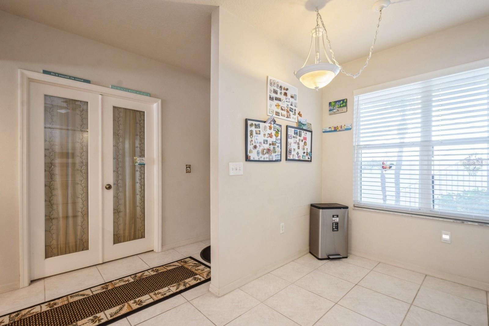 Doors to 3rd bedroom. Kitchen has room for a cafe table and chairs