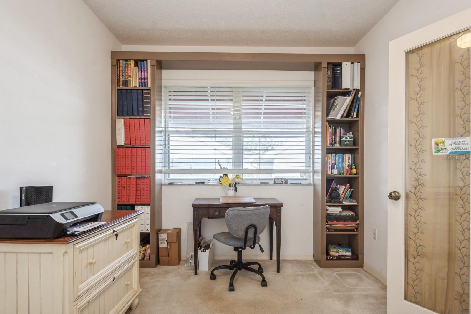 3rd bedroom/office with built in bookcase