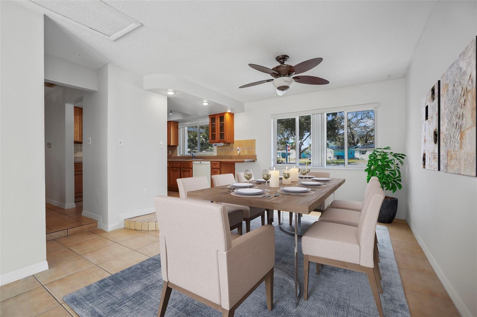 Dining Room opens to the kitchen. Virtual Staging.