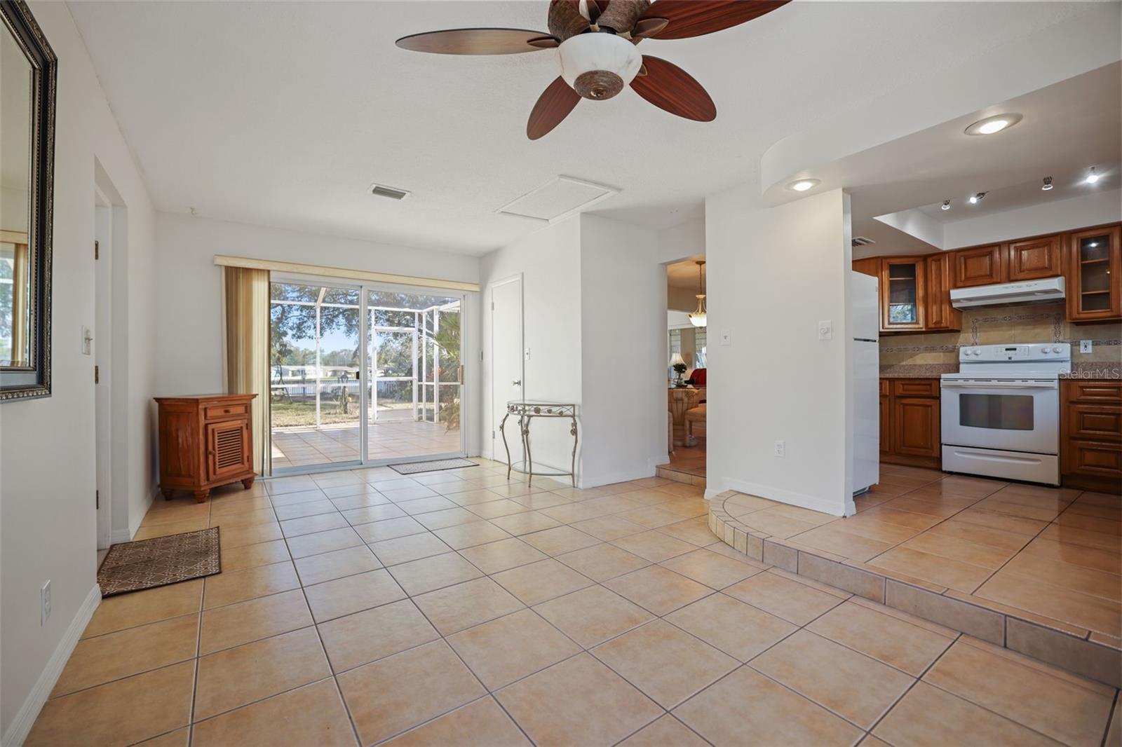 Dining room opens to kitchen and screened lanai.  This could be a family room as well