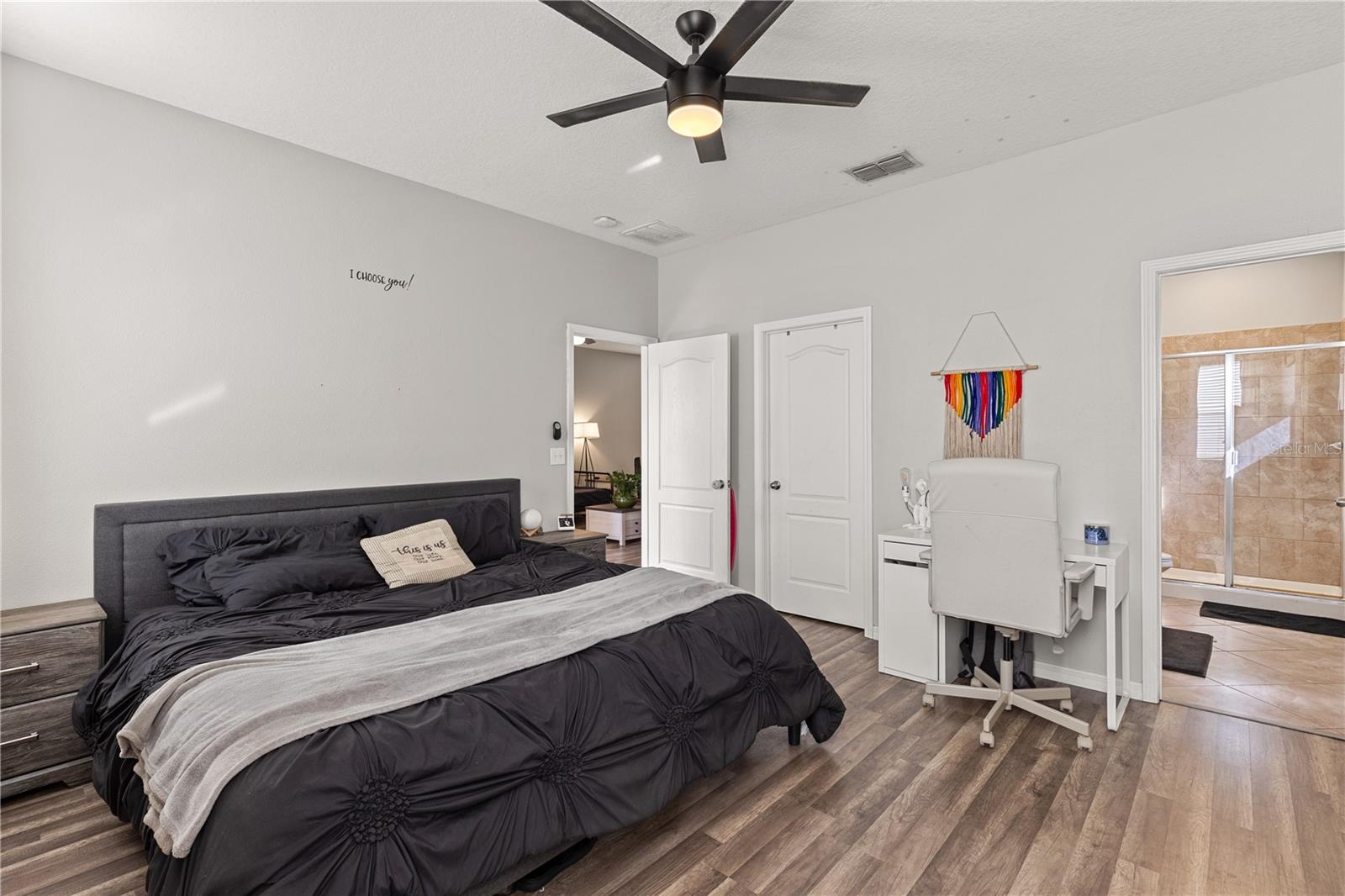 Primary bedroom with walk-in closet and ensuite