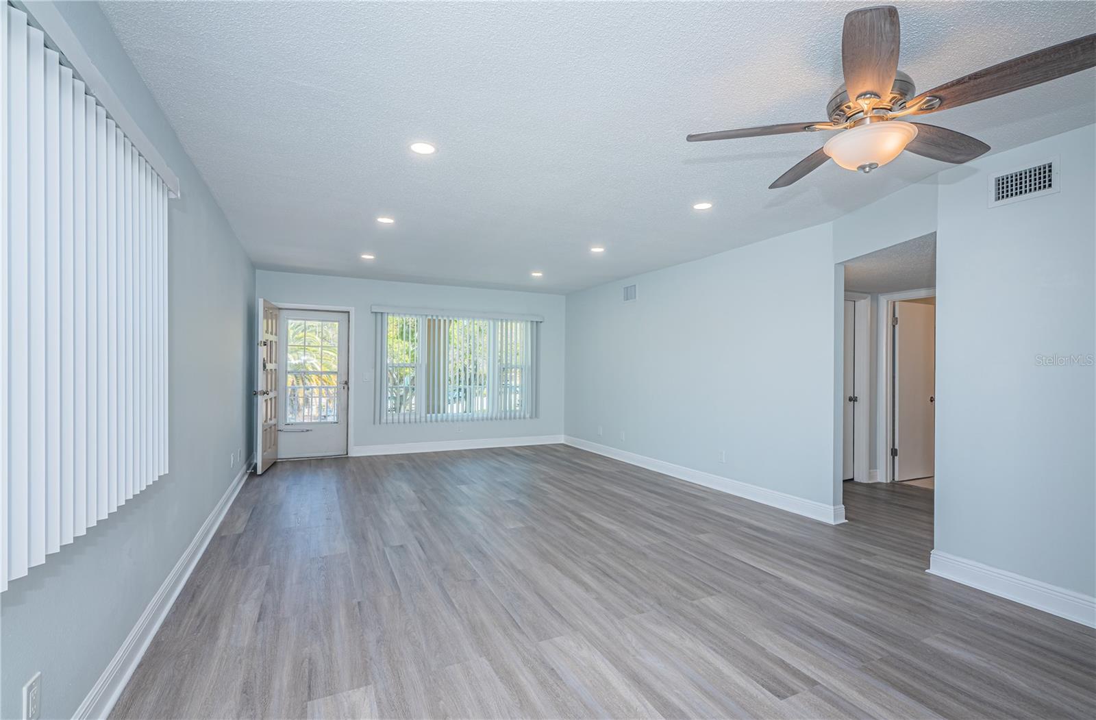 Living/Dining main entrance (unstaged) hallway to front bedroom and 2nd bath