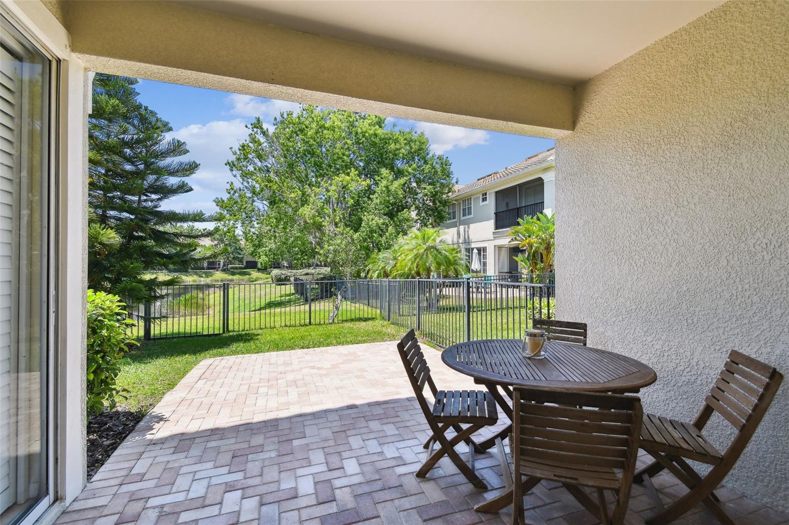 Fenced-In Yard with Pond Views
