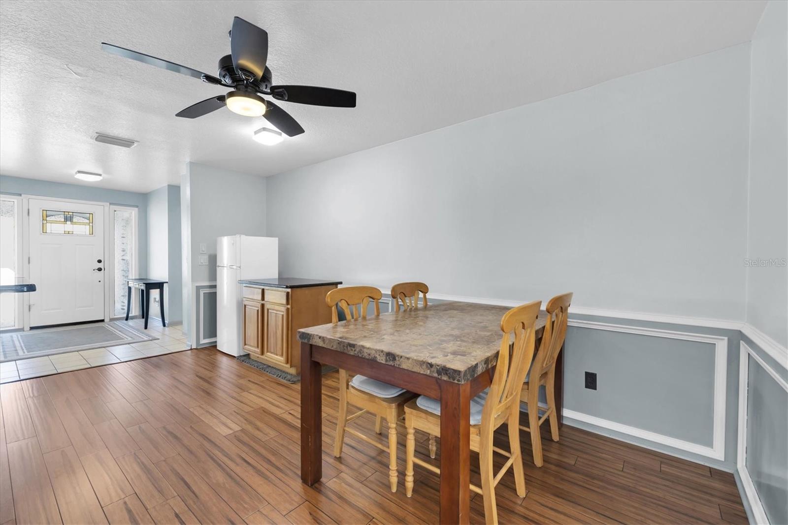 Dinette area (could be used as formal dining room) facing towards entry way and front door.