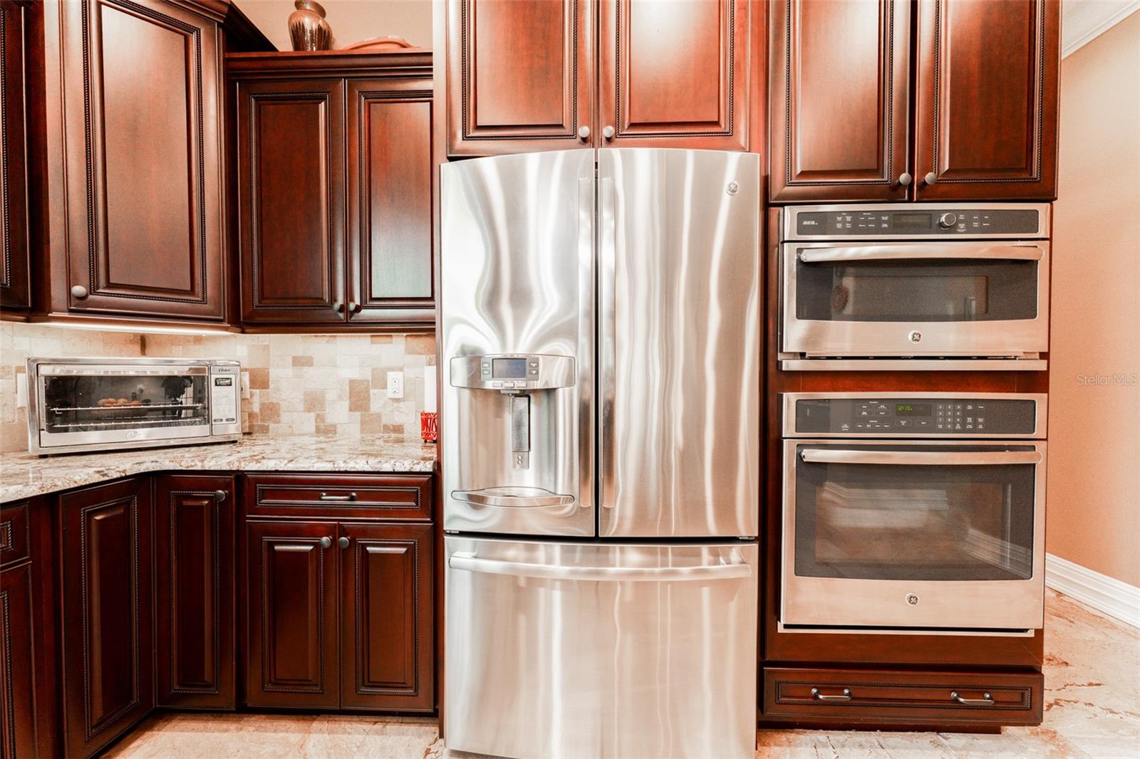 Top of the line SS appliances including wall oven, microwave, dishwasher, fridge & wine chiller